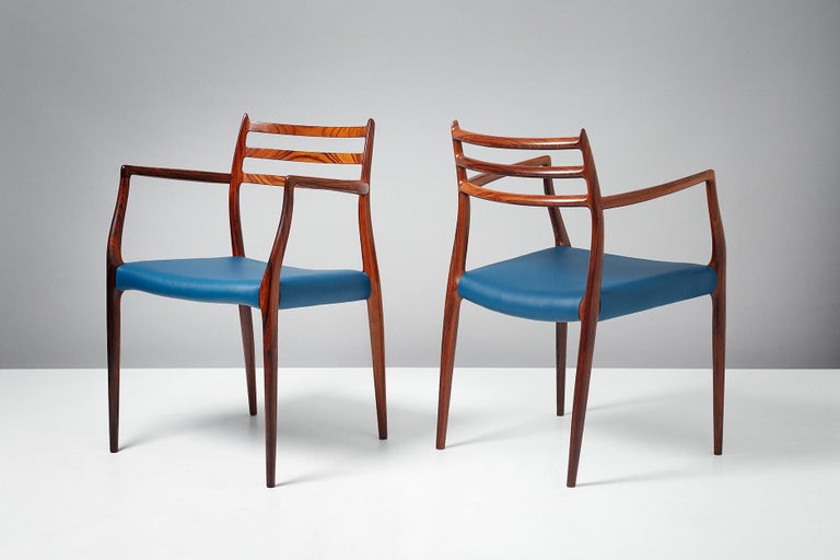 Niels Moller

Pair of model 62 armchairs, circa 1962

Rosewood armchairs designed by Niels Moller for J.L. Moller Mobelfabrik, Denmark, 1962 with new majolica blue leather seats. These examples are early productions featuring more slender frames