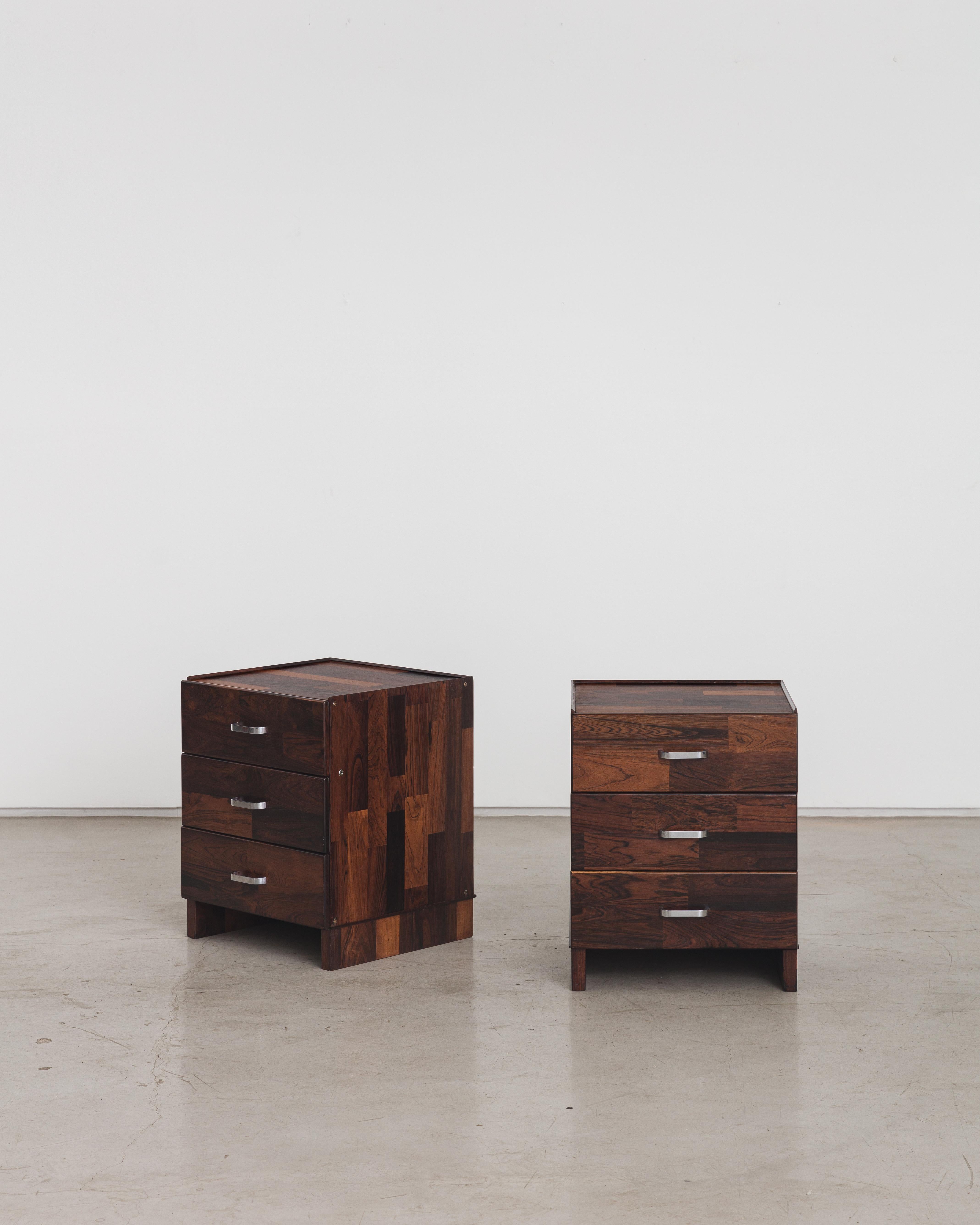 A drawer cabinet with three drawers and chrome handles designed by Jorge Zalszupin and manufactured by his company, L'Atelier. The piece is entirely covered with rectangular pieces of marquetry wood, a creative resource developed by Zalszupin. The