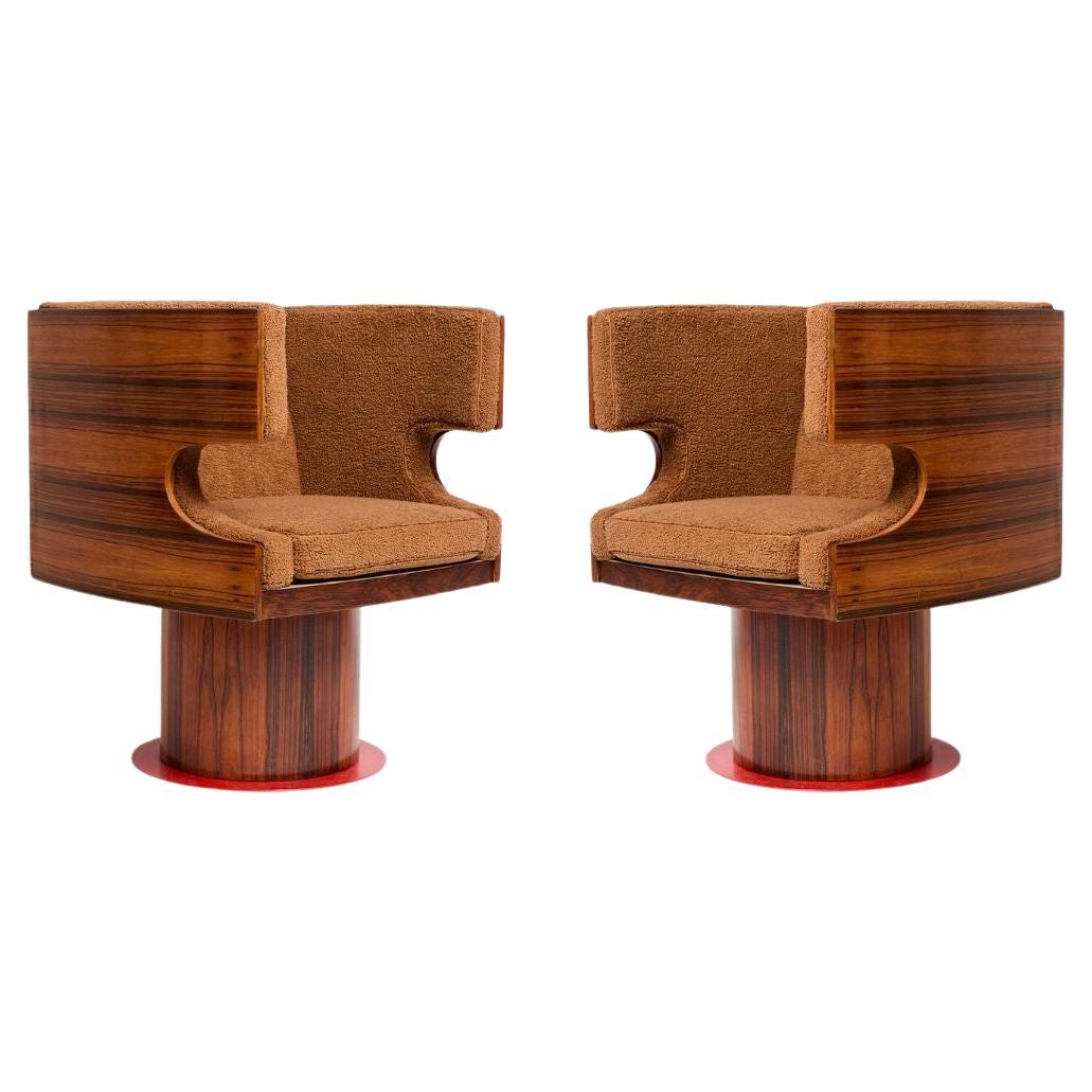 Paire de fauteuils pivotants en bois de rose