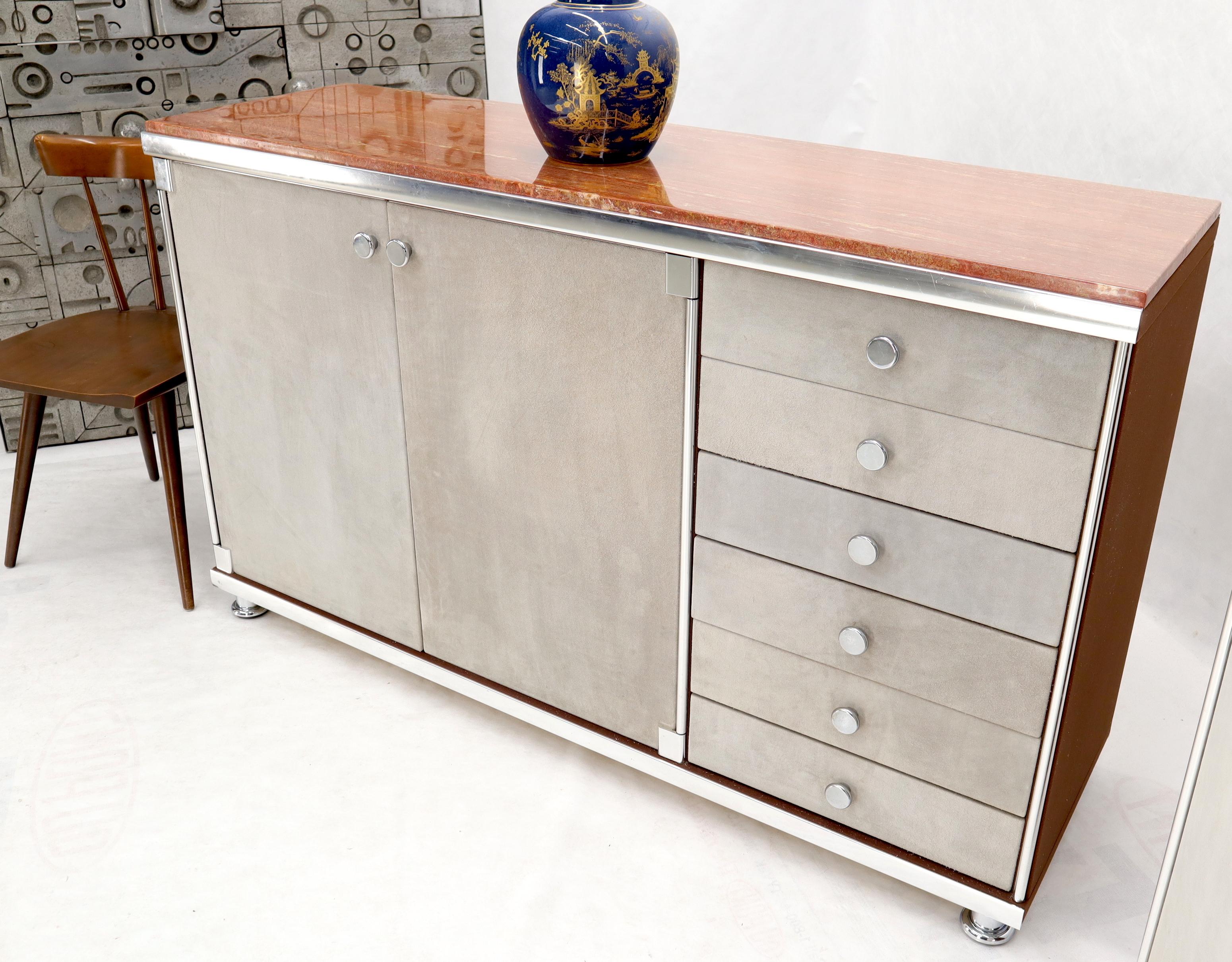 Pair of Mid-Century Modern marble-top dressers finished in grey real suede leather by Guido Faleschini for Mariani. High quality gloss finish vivid rouge color marble tops. Lots of space in the compartments and six 6 drawers.