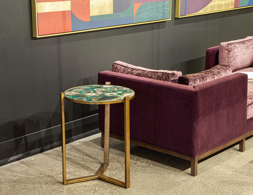 Elevate your living space with this striking pair of Round Agate Top Accent Tables. Each table boasts a unique, mesmerizing agate top, swirling with captivating tones of turquoise greens and aquas that make them an instant focal point. The sleek,