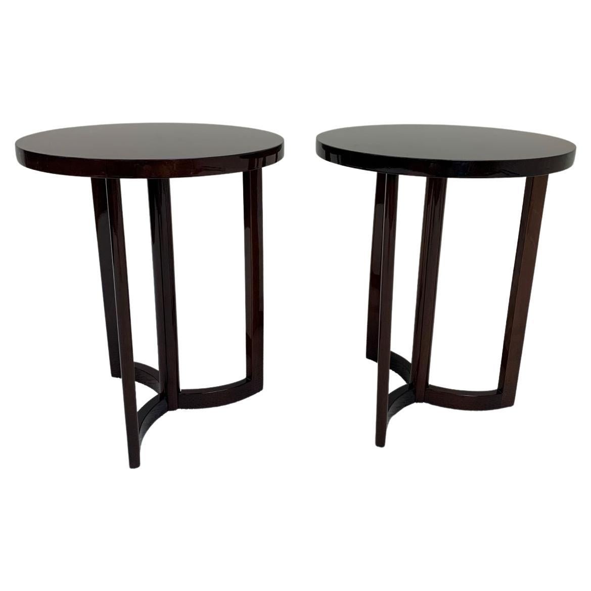 Great pair of round Art Deco end tables with solid walnut bases with a unique pinwheel design. Table tops are adorned with a beautiful walnut veneer tops. Tables could be used either as side tables or bedside tables. American C. 1940’s dimensions