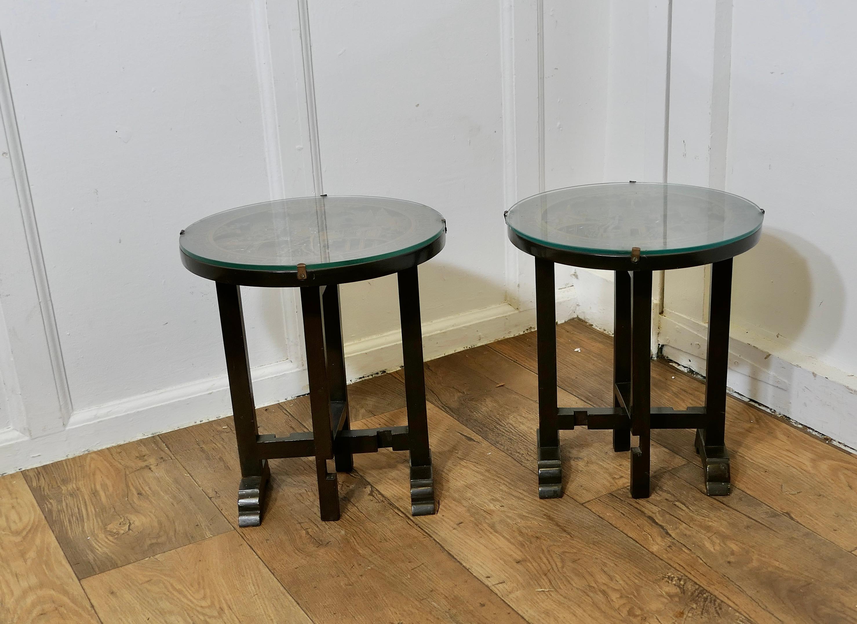Pair of Round Carved Oriantal Folding Side Tables

A very useful duet, folding side end lamp or wine tables with glass tops
The tables have a deeply carved relief decoration of Water Scenes, they both have a protective plate glass cover on the