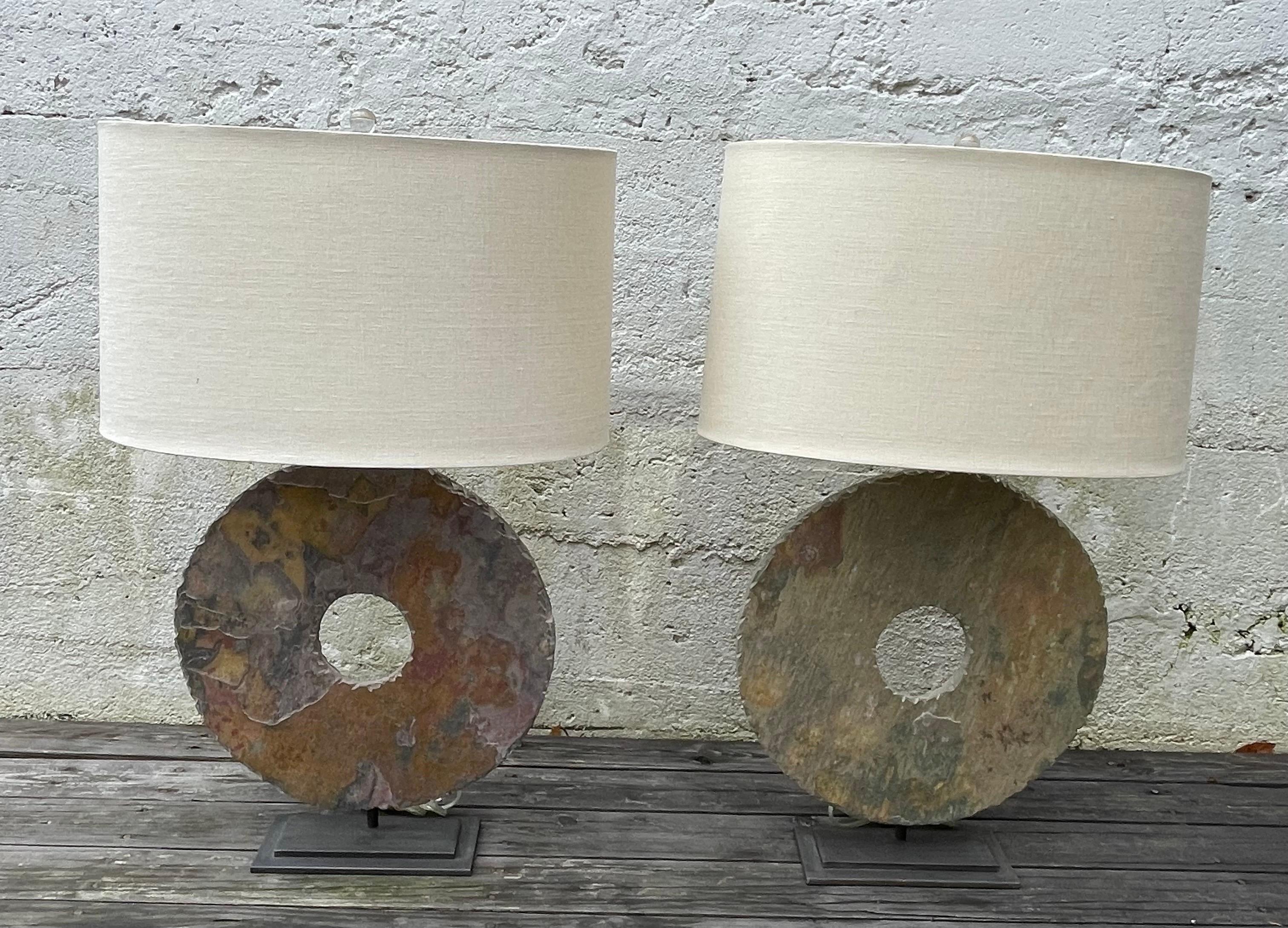 Pair of Contemporary modern table lamps, hand-carved slate mounted on iron metal stands, linen white oval shades included.
