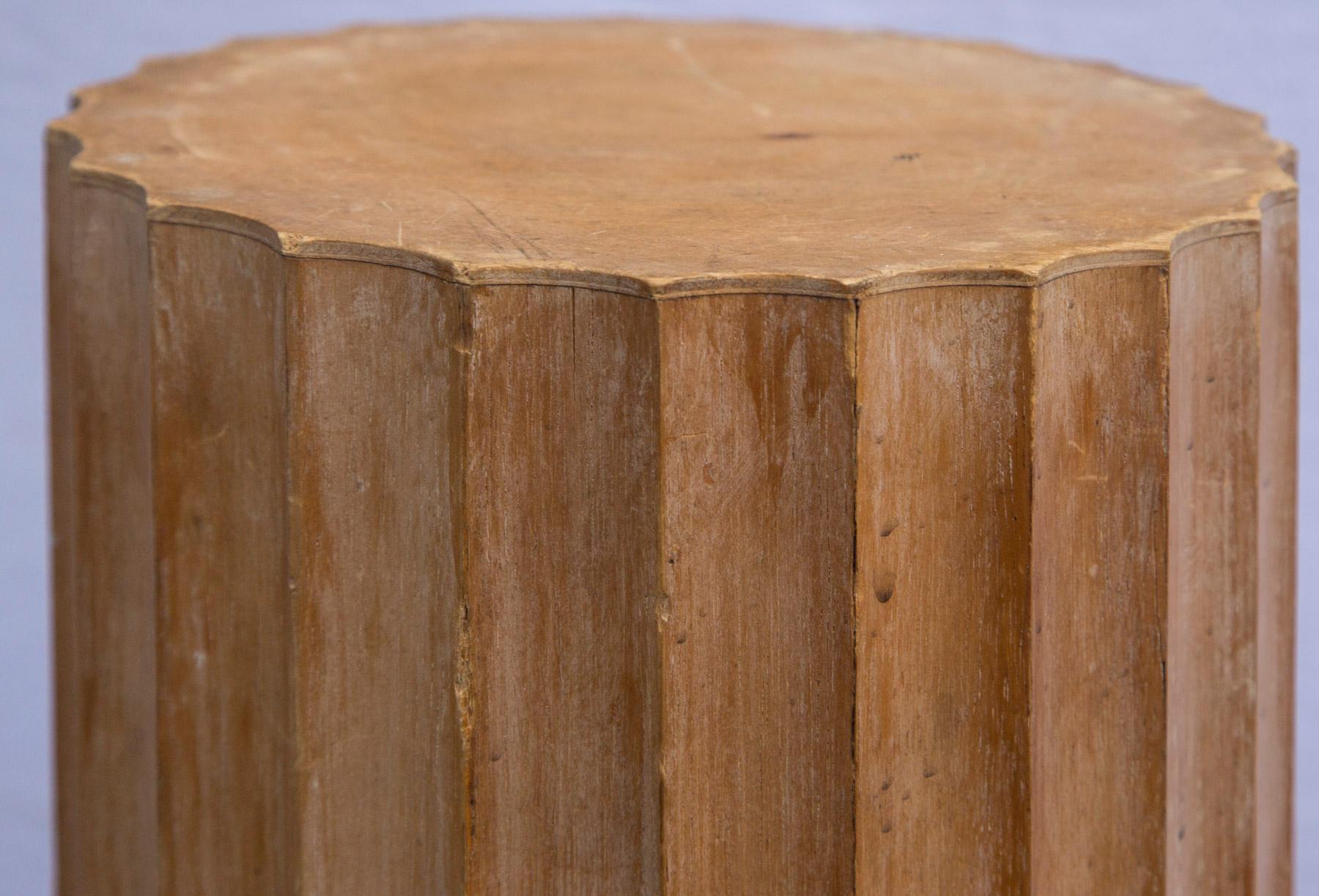 Pair of round fluted wood columns, set on 13 inch square bases.