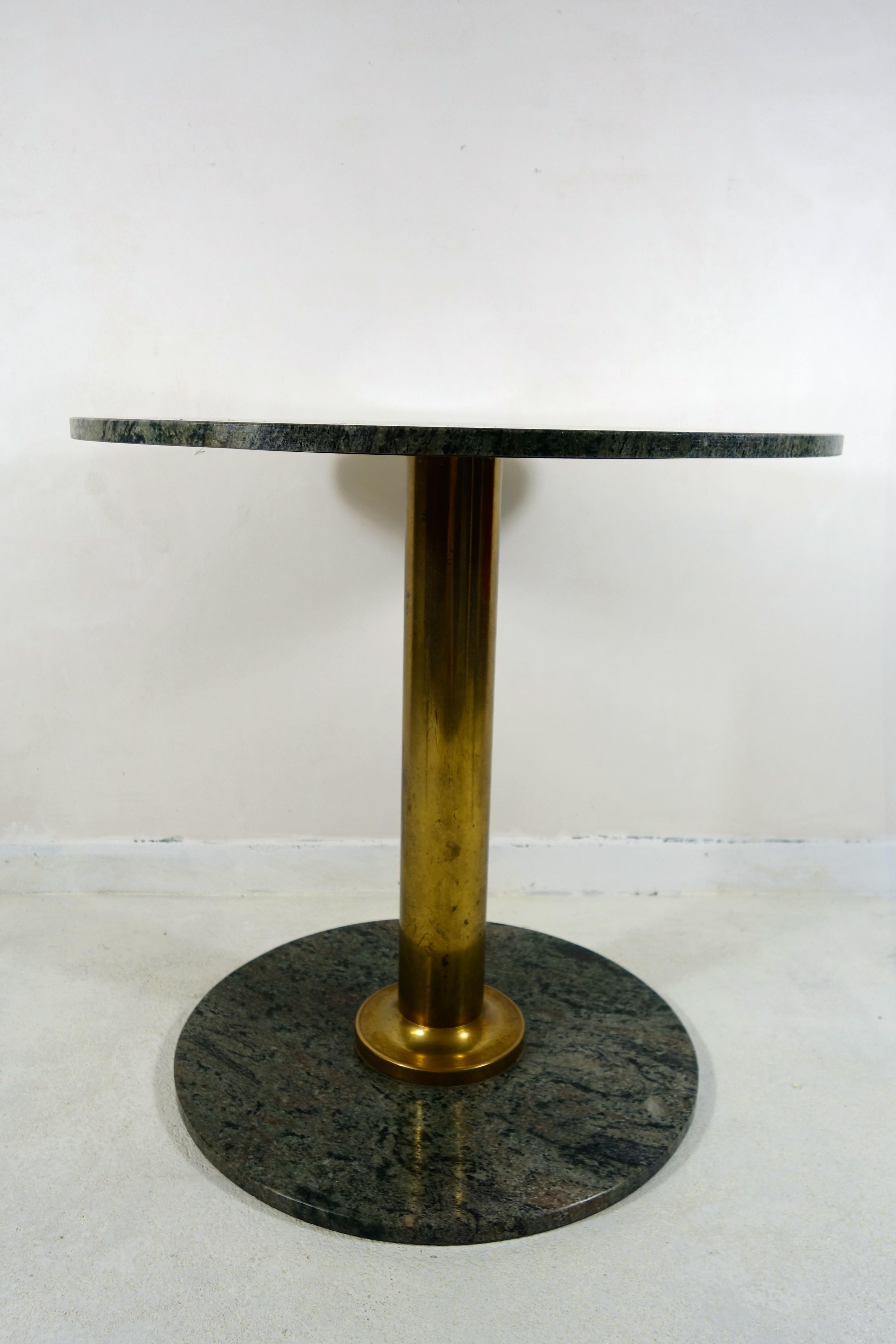 German Pair of round Hollywood Regency Tables with Brass Foot and Granite Top