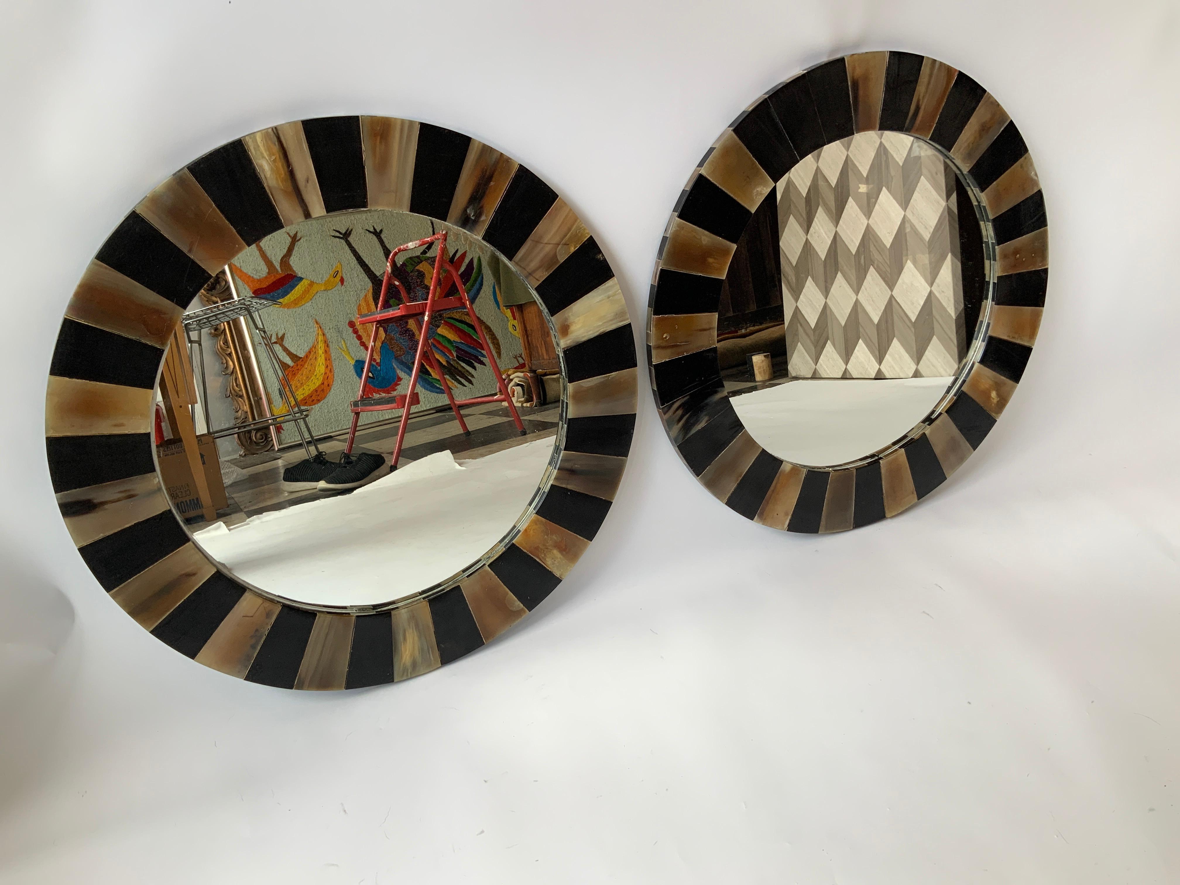 Pair of round horn mirrors. Frame is made of squares of horn.