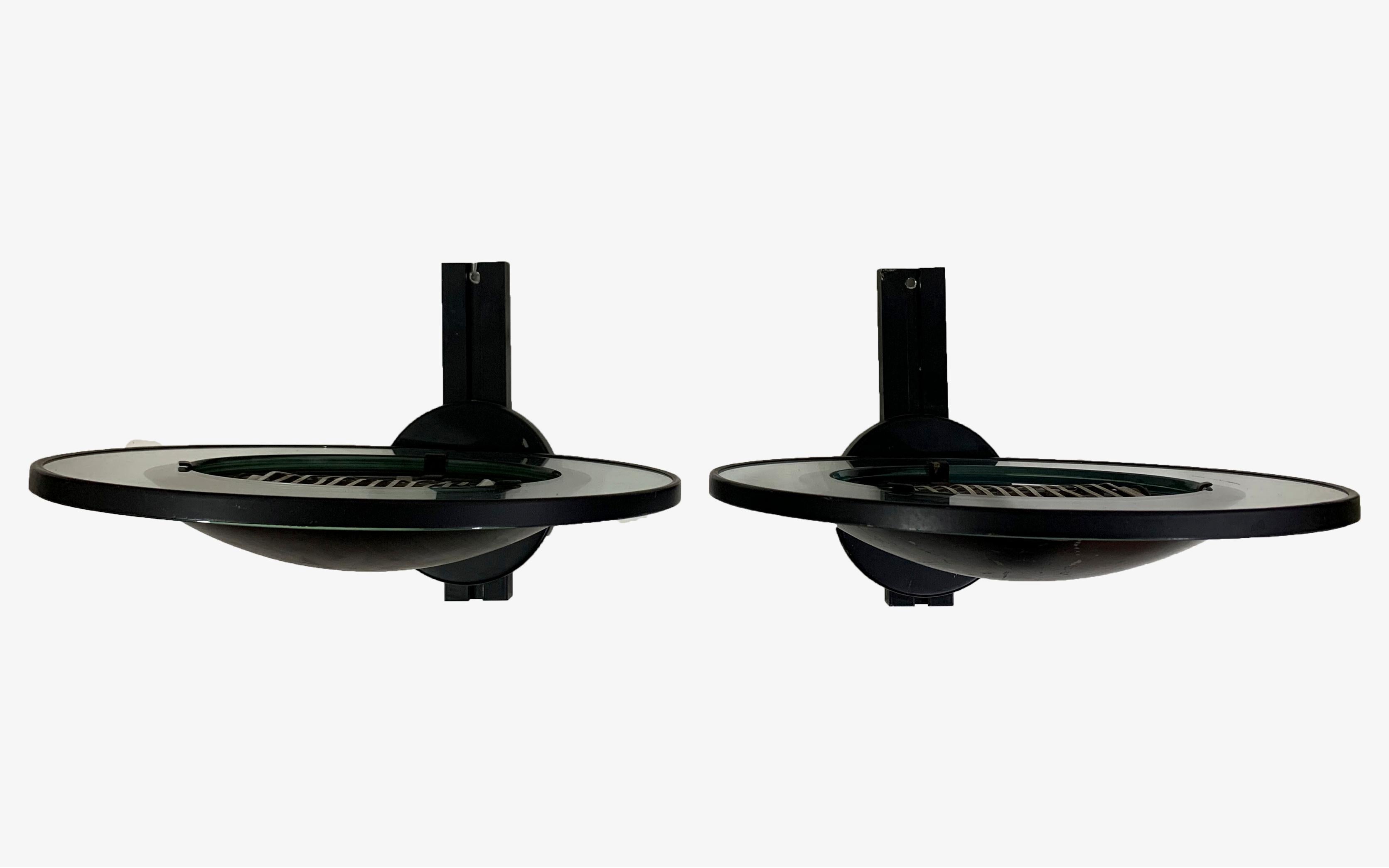 Molded Pair of round metal black wall sconces by Etiluz For Sale