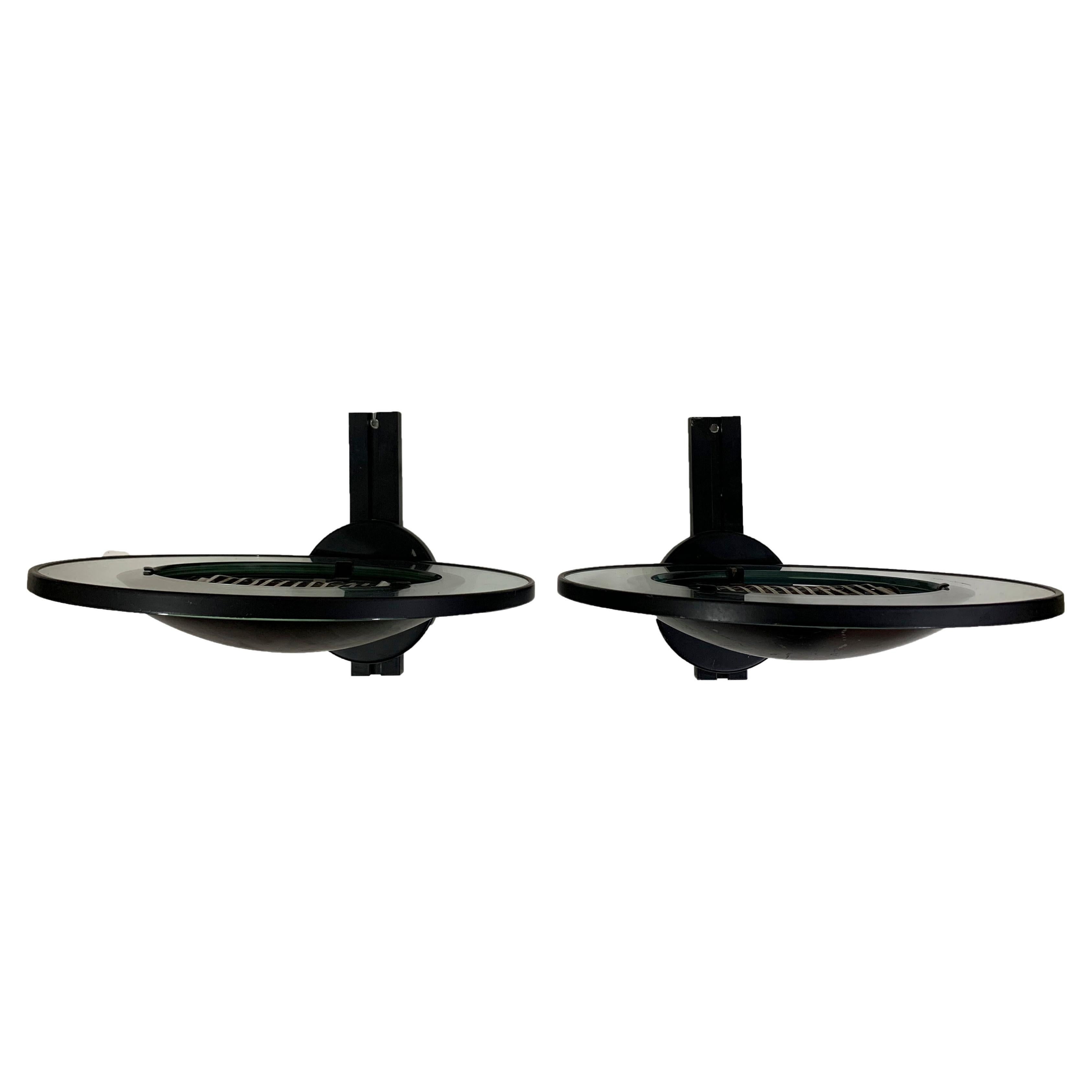 Pair of round metal black wall sconces by Etiluz