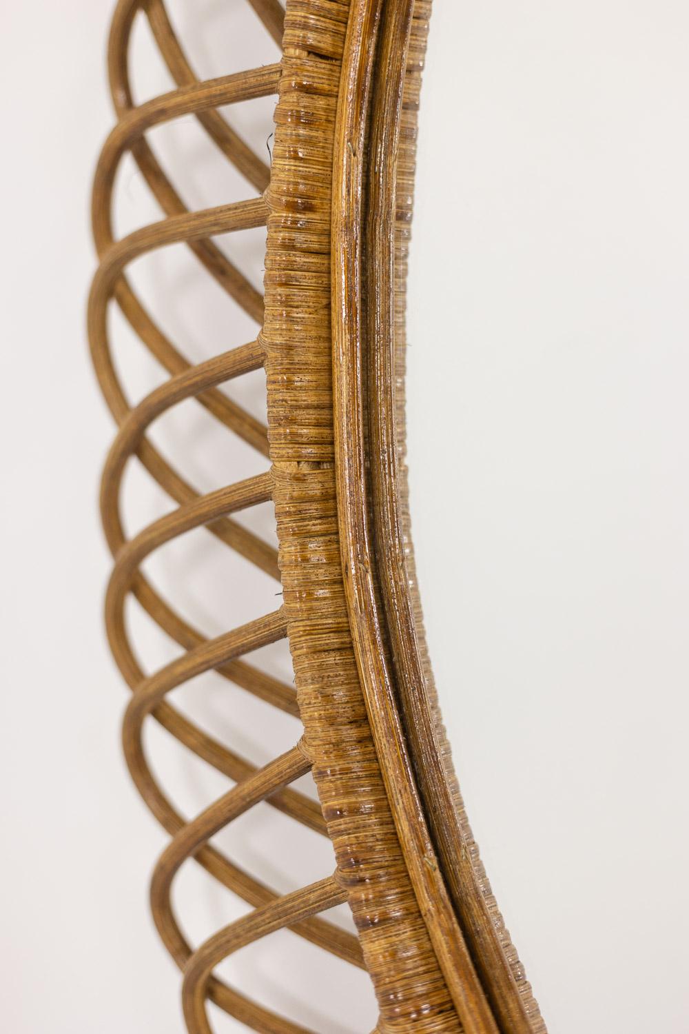 Italian Pair of round rattan mirrors with interlacing. 1980s. For Sale