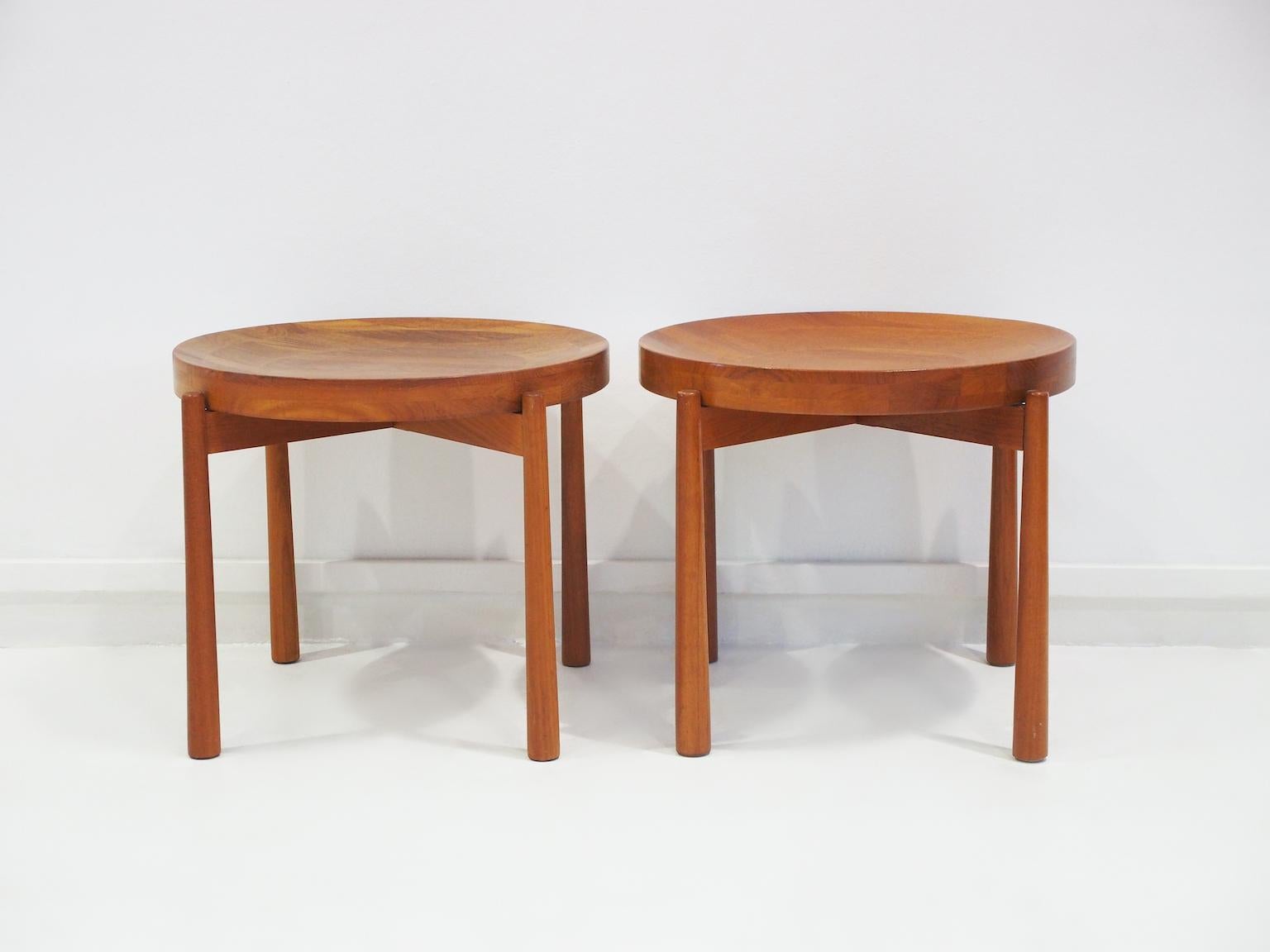 Pair of round teak side tables with reversible top that can be used alone as a fruit bowl or as a table when the other flat side is up. Danish design attributed to Jens Harald Quistgaard.