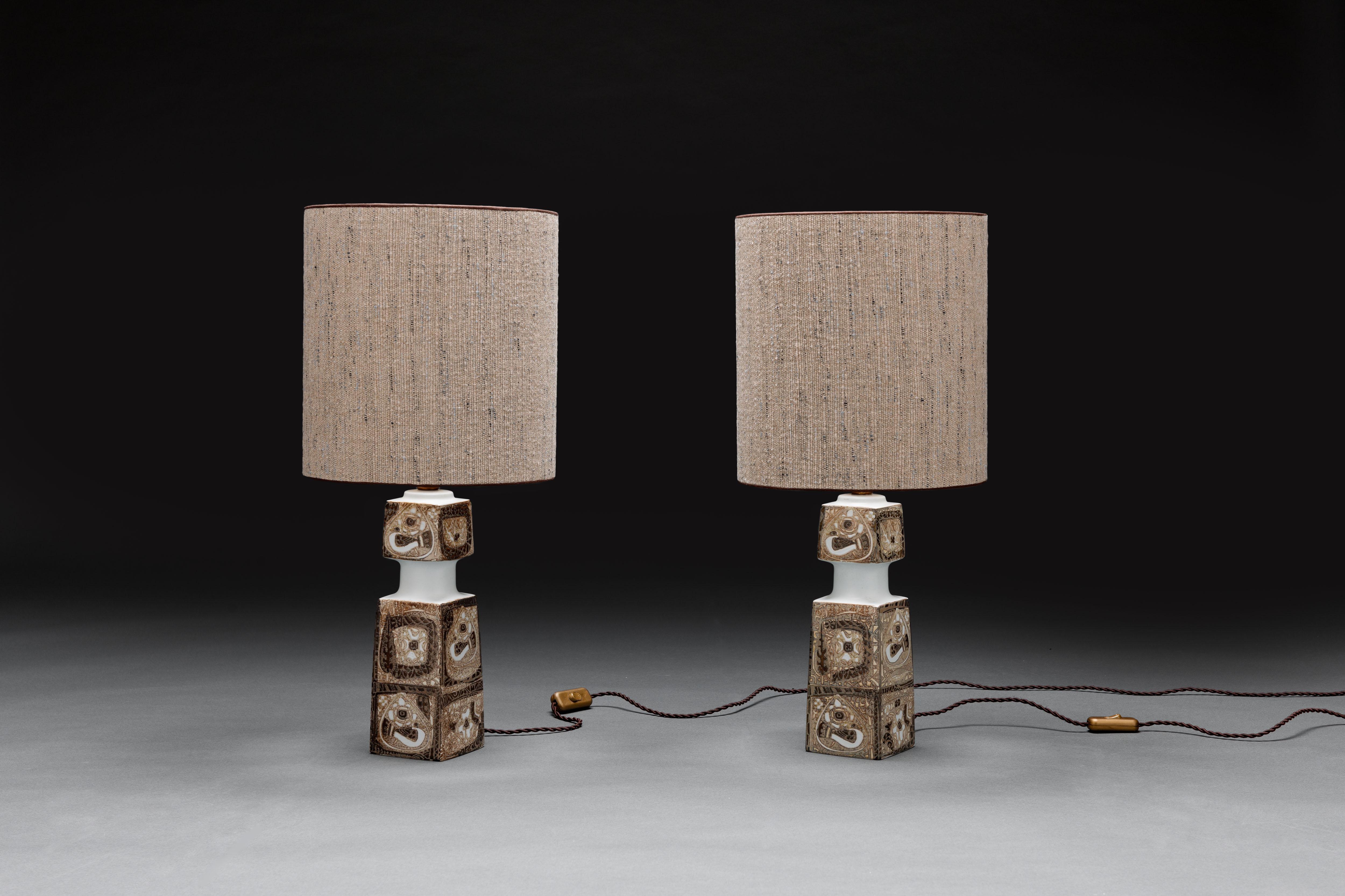 Beautiful pair of Scandinavian faience glazed earthenware table lamps from the 'Baca' series by Danish artist Nils Thorsson for Royal Copenhagen & Fog & Morup
Denmark. 

Lamps are executed with quality custom hand-made lamp shades upholstered in