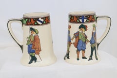 Pair of Royal Doulton New Cavaliers tankards or steins with pattern D4749
