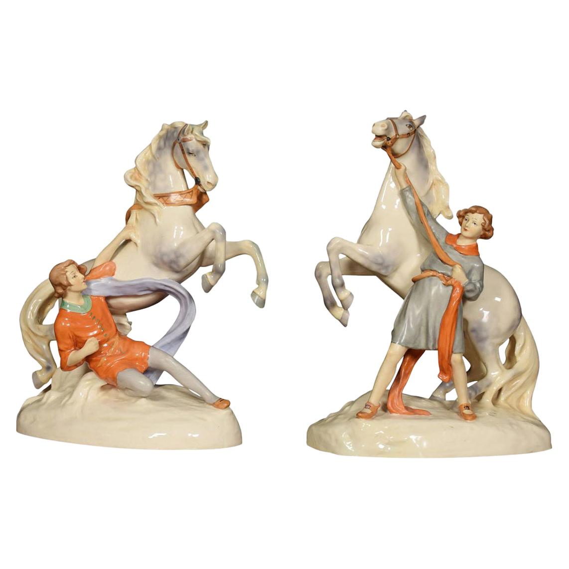 Pair of Royal Dux Figure Groups of Young Men with Horses For Sale
