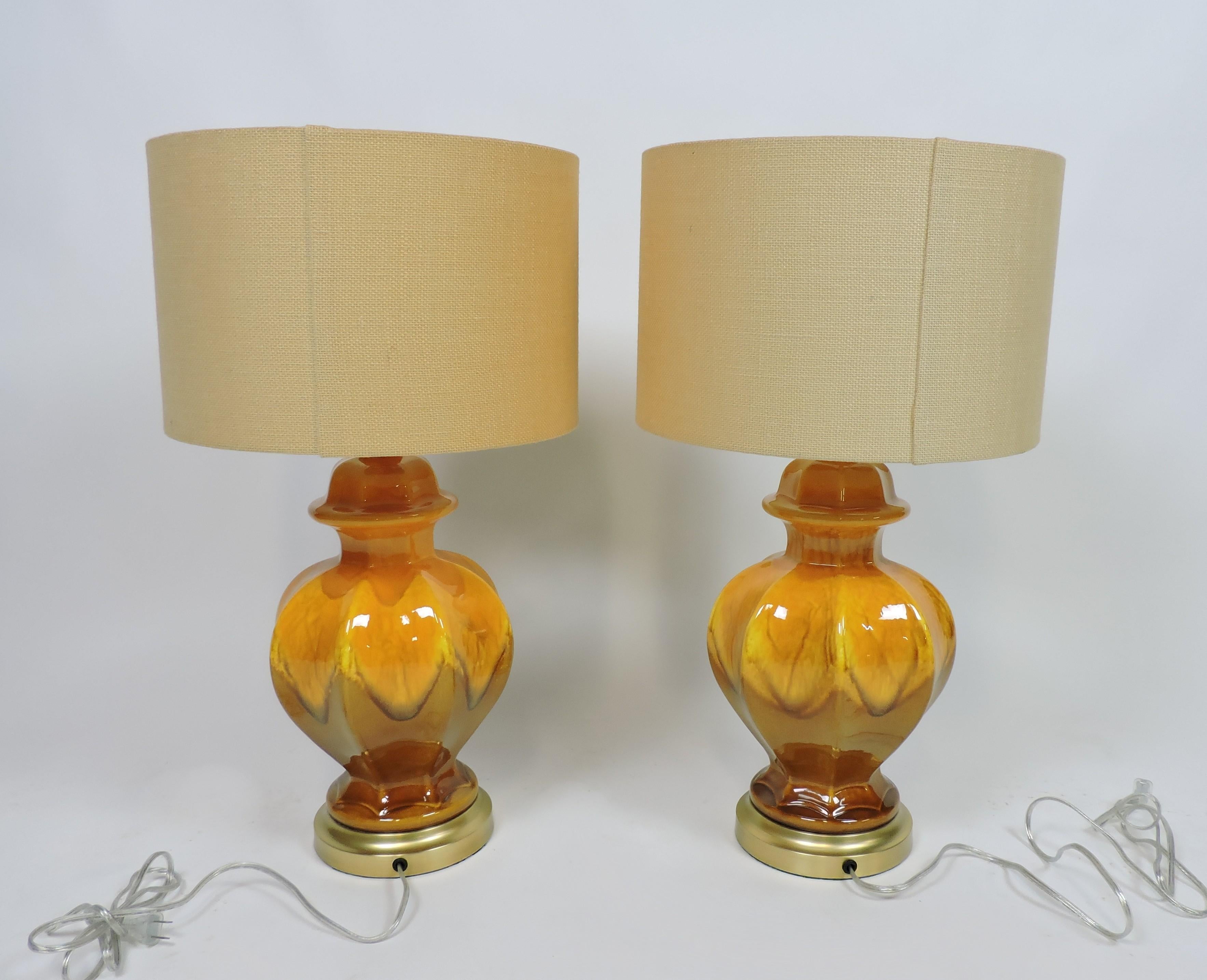 Beautiful pair of table lamps attributed to Royal Haeger. These ceramic lamps have a ginger jar shape with a vibrantly colored drip glaze.
Just let us know if you would like to have them shipped without the shades, it would be less expensive.