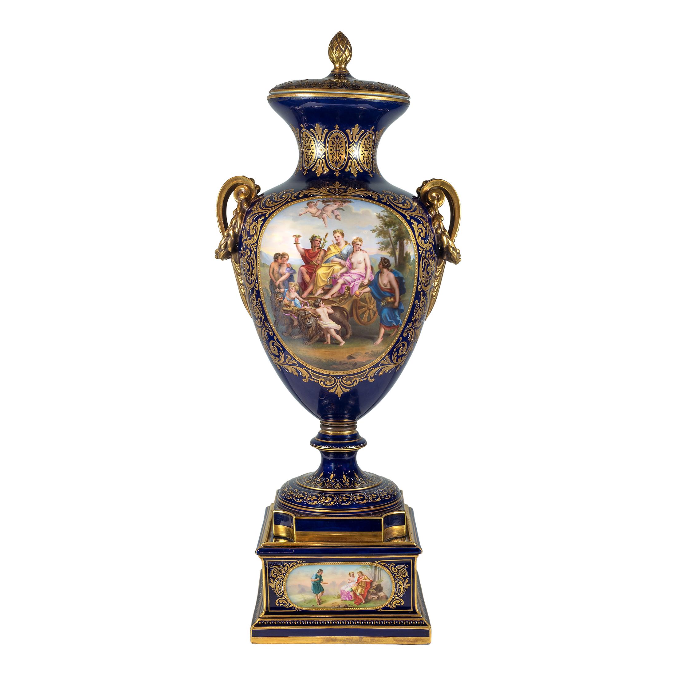 Highly important pair of royal Vienna painted porcelain urn and cover
Painted with two large allegorical scenes. Cobalt blue ground with gold raised decoration and two handles. Signed ‘F. Koller’.

Origin: Austria
Date: 19th century
Dimension:
