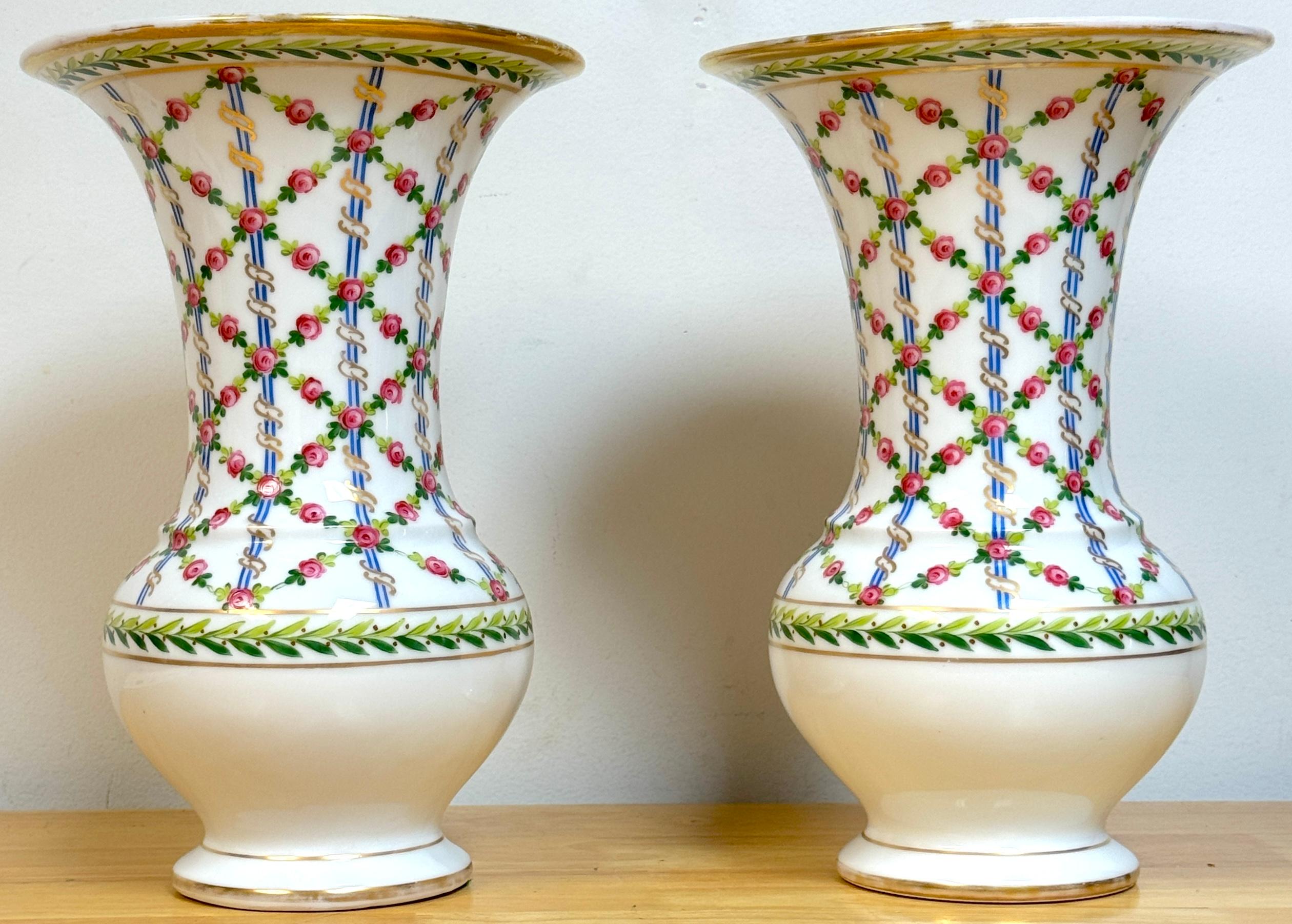 Pair of Royal Vienna Sevres Style Floral Trellis Vases, Artist Signed 'Nash'
Royal Vienna blue underglaze Beehive mark, decorated Saxe Porcelain Blanks, Painters Mark # 2042 al. 

This exquisite pair of Royal Vienna Sevres-style floral trellis