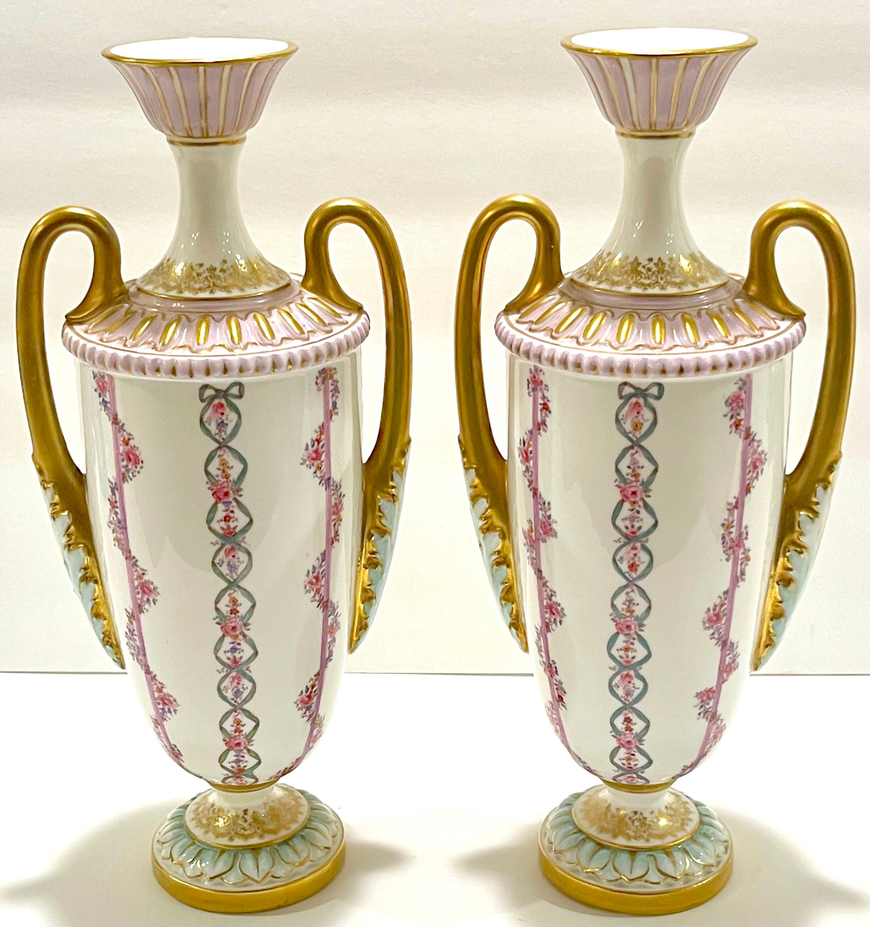 Pair of Royal Worcester Transitional Neoclassical style vases, England, 1901.
Date marked with green backs-tamp with five dots to the left and right.
'Leadless Glaze- English Registry Mark'

Each vase shape #2129, with stylized plume top, fitted