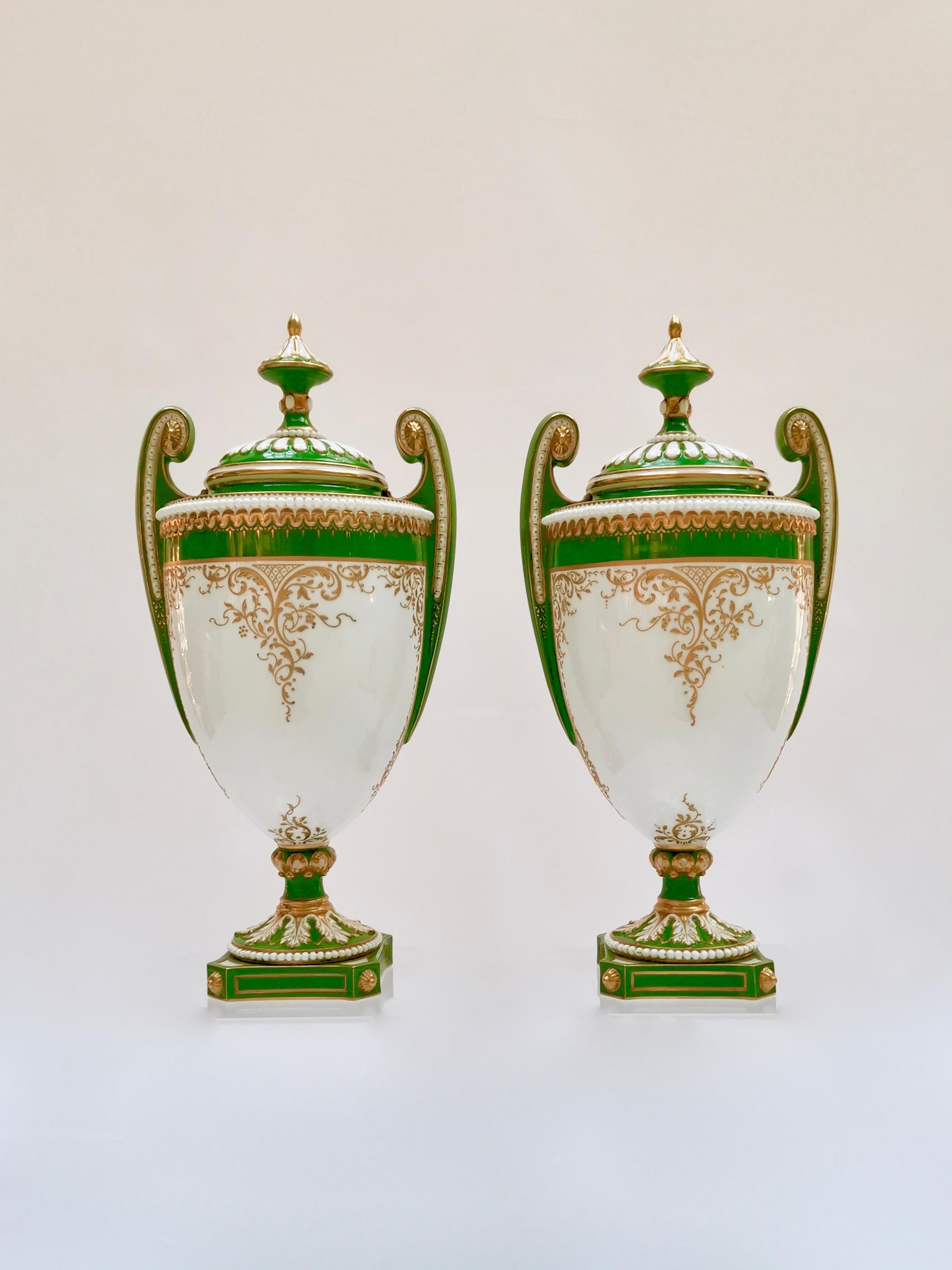 This is a pair of beautiful vases with cover made by Royal Worcester in 1907, painted and signed by the famous porcelain artist William Hawkins.

The original Worcester pottery was founded in the mid-18th century and belongs to the group of famous