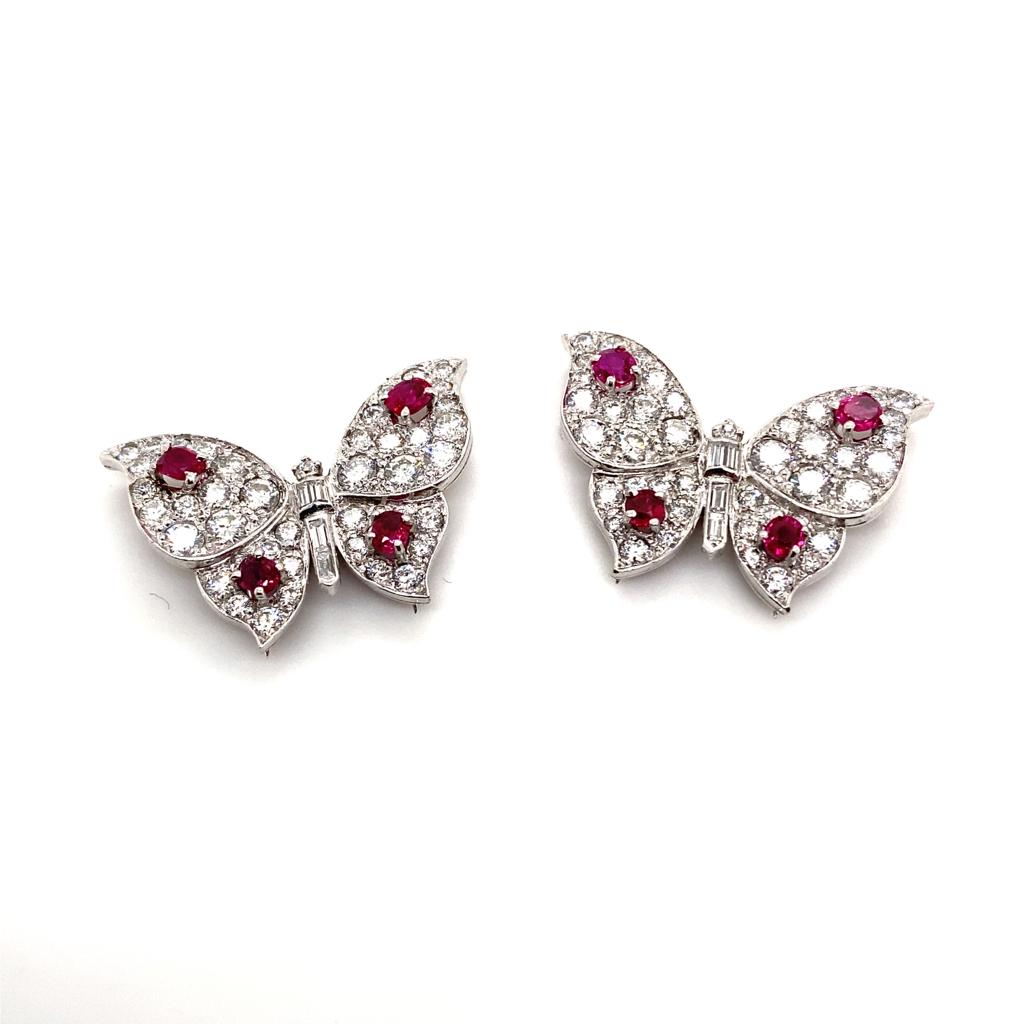 A pair of ruby and diamond butterfly brooches, by Suzanne Belperron.

Each designed as a butterfly with pavé-set diamond wings, enhanced by circular-cut ruby detail, to the baguette-cut diamond body, with French assay marks for platinum and