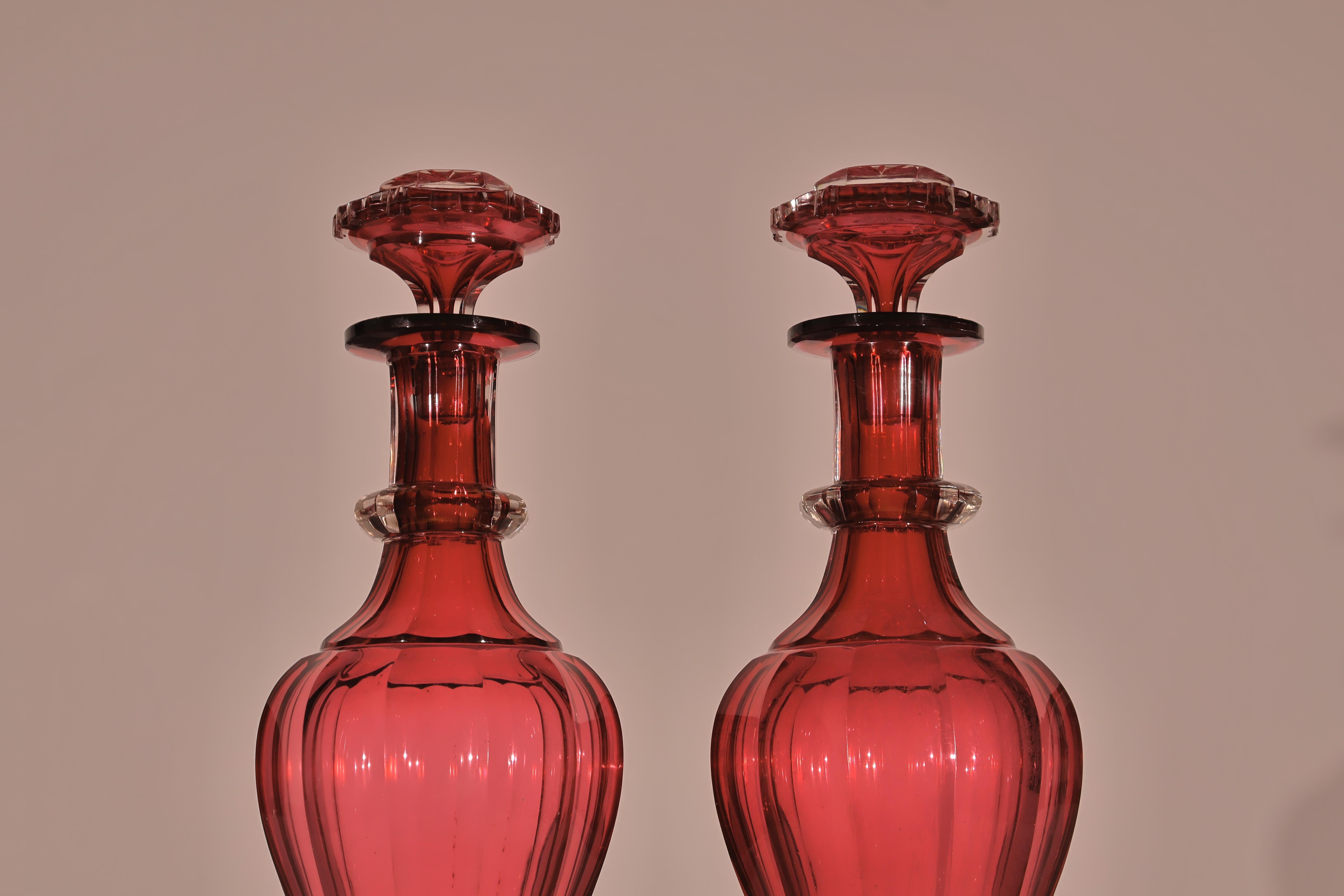 A Very Fine & Elegant Pair of Ruby Crystal Decanters with Lids. 
Bohemia, circa 1880.
Dimensions: Height 12 1/4