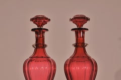Pair of Ruby Decanters with Lids.