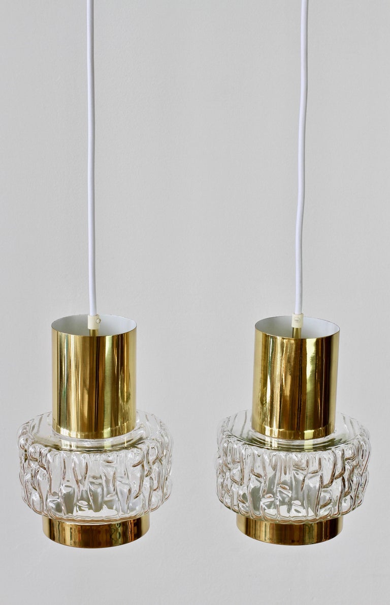 One of those special pieces which seldom becomes available. Stunning elegant pair of brass and clear textured bubble glass light fixtures by Austrian lighting firm Rupert Nikoll. Similar, in style, to fellow Austrian lighting manufacturer, J.T.