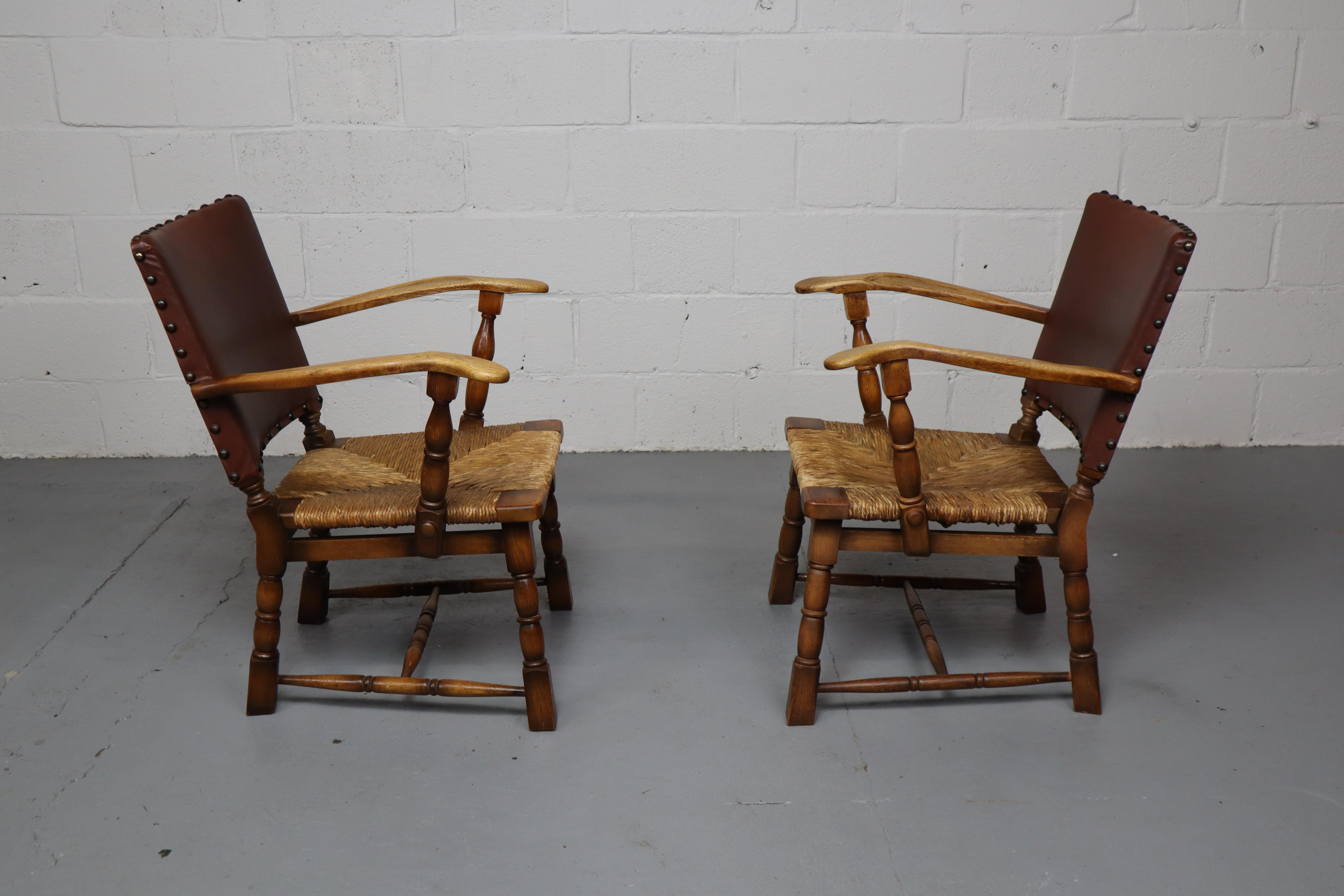 Pair of rush and oak armchairs by De Ster Gelderland, Netherlands 1950's. In Good Condition For Sale In Langemark-Poelkapelle, BE