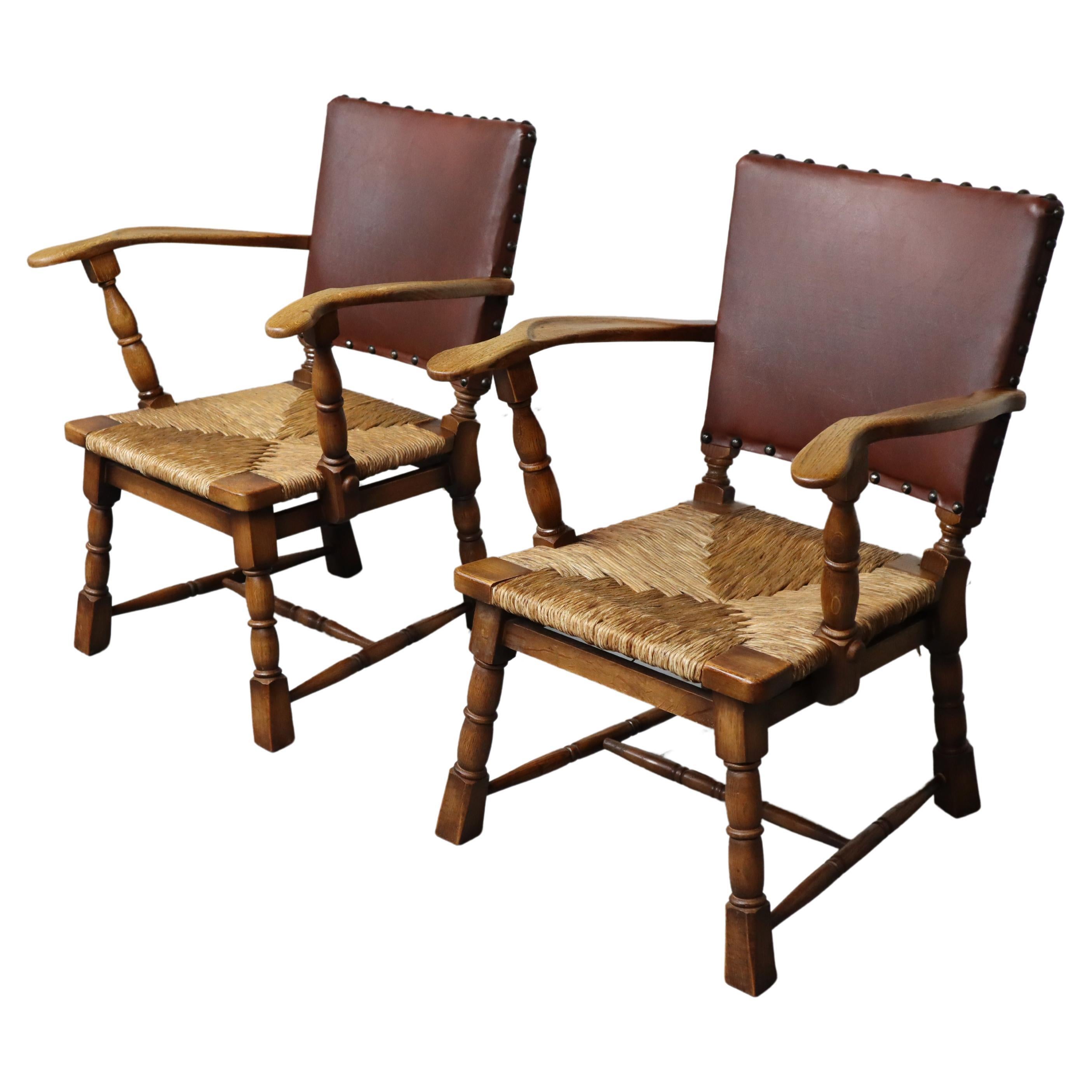 Pair of rush and oak armchairs by De Ster Gelderland, Netherlands 1950's. For Sale