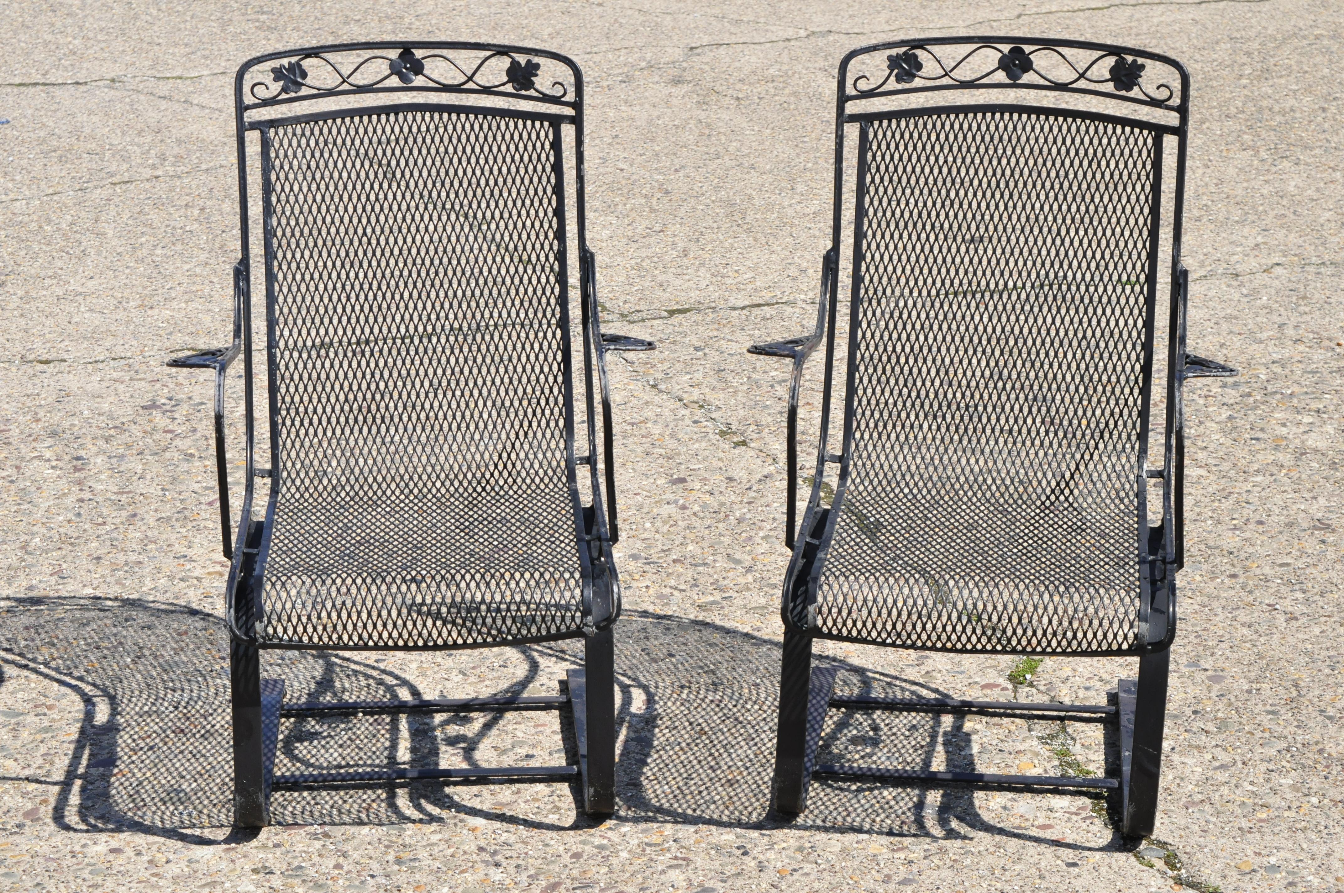 Pair of vintage Russel Woodard wrought iron Garden Patio bouncer lounge armchair Maple Leaf. Item features scrolling maple leaf design to back and arms, metal mesh seat and back wrought iron construction, quality American craftsmanship, great style