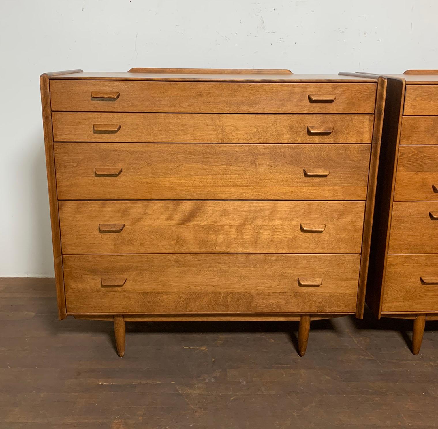 Pair of five drawer dressers designed by Russel Wright for Conant Ball, circa 1950s.  Note dressers are the same size but have slightly different handle configurations.
