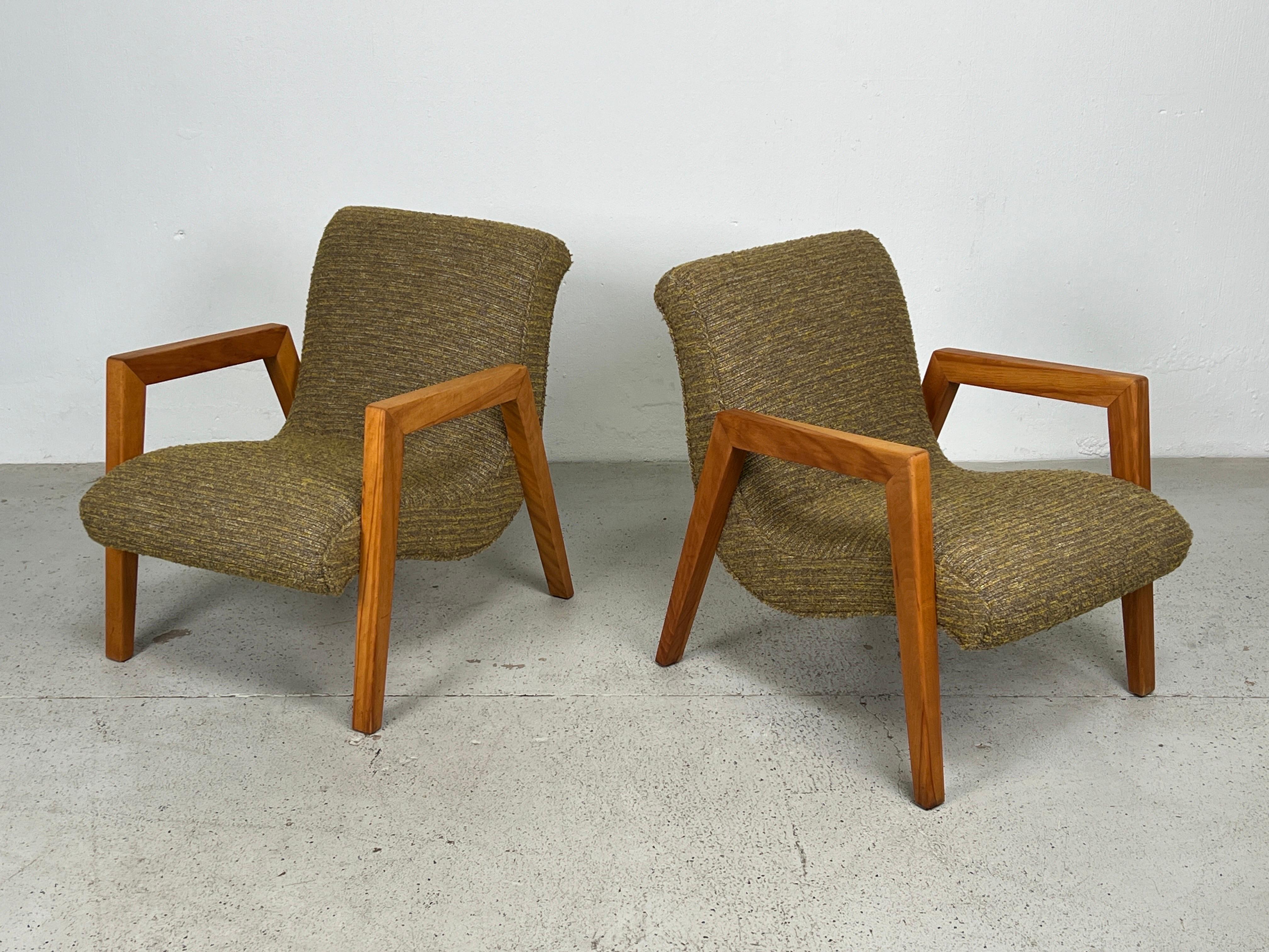 A pair of maple framed lounge chairs by Russell Wright for Conant Ball. 