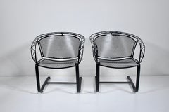 Pareja de mecedoras Russell Woodard negras, años 50