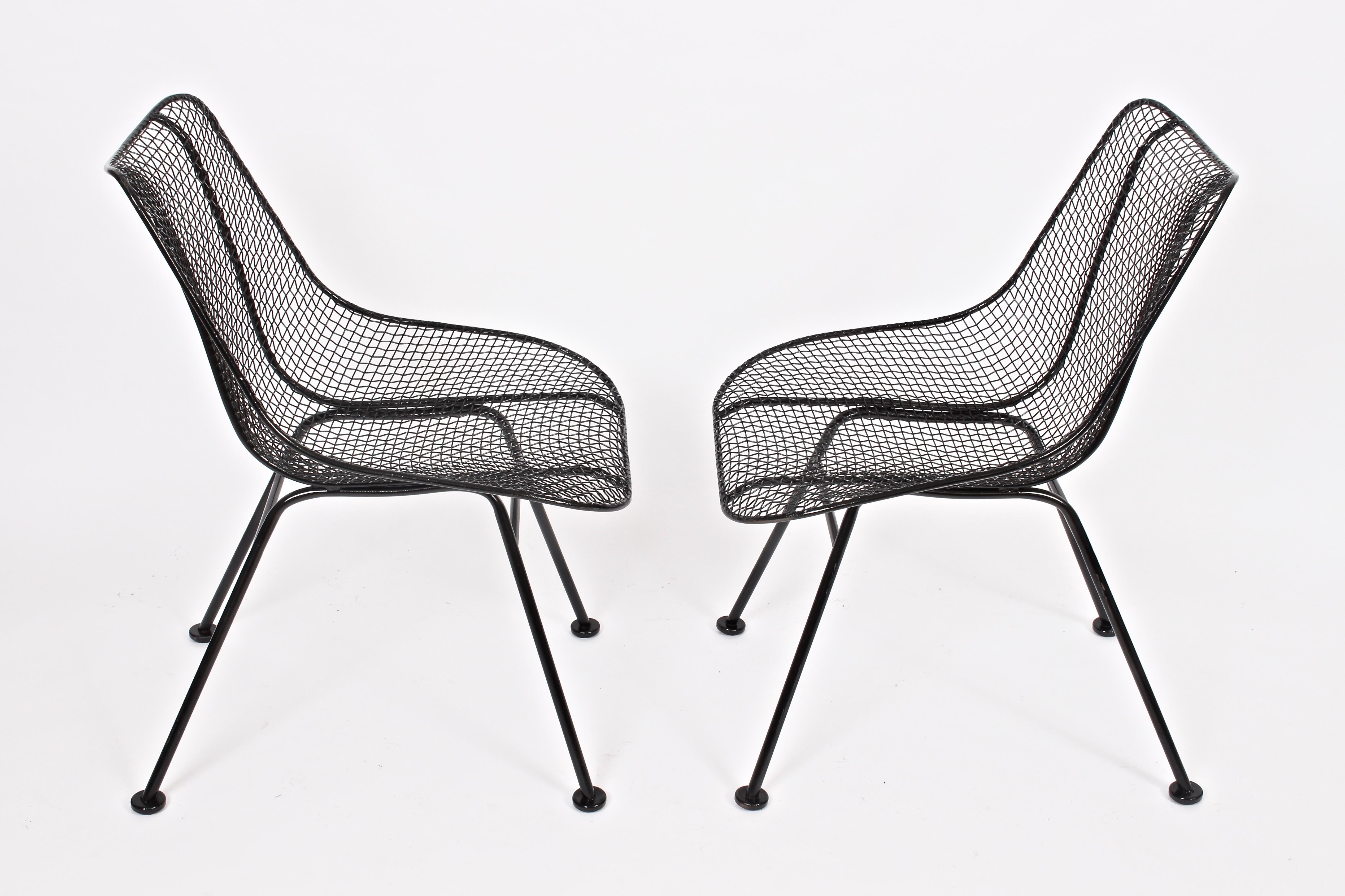 Original Pair of Russell Woodard black enamel Sculptura dining height side chairs, 1950's.  Handcrafted in wrought iron and woven wire mesh. Suitable for Indoor / Outdoor use. Professionally powder coated and coated in gloss black enamel paint. Like
