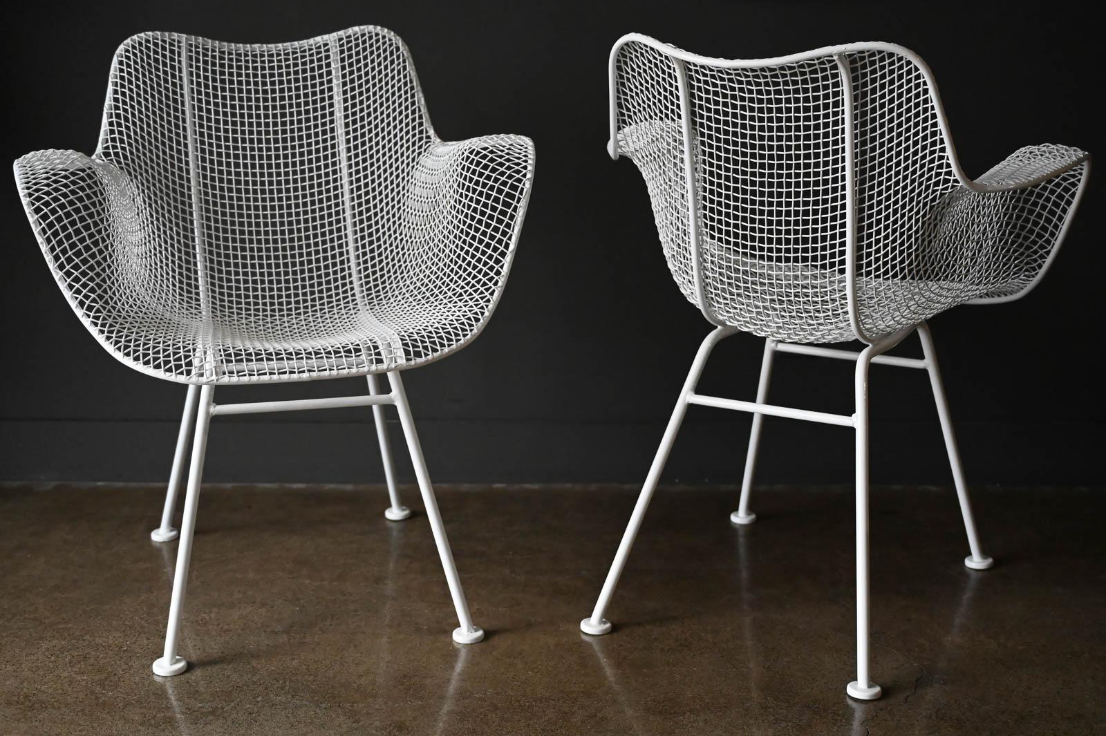 Pair of Russell Woodard Sculptura Outdoor Chairs, circa 1950. Professionally restored with new white gloss powder coat. All welds are intact with no breaks. Truly a beautiful, sculpted set of outdoor chairs.

