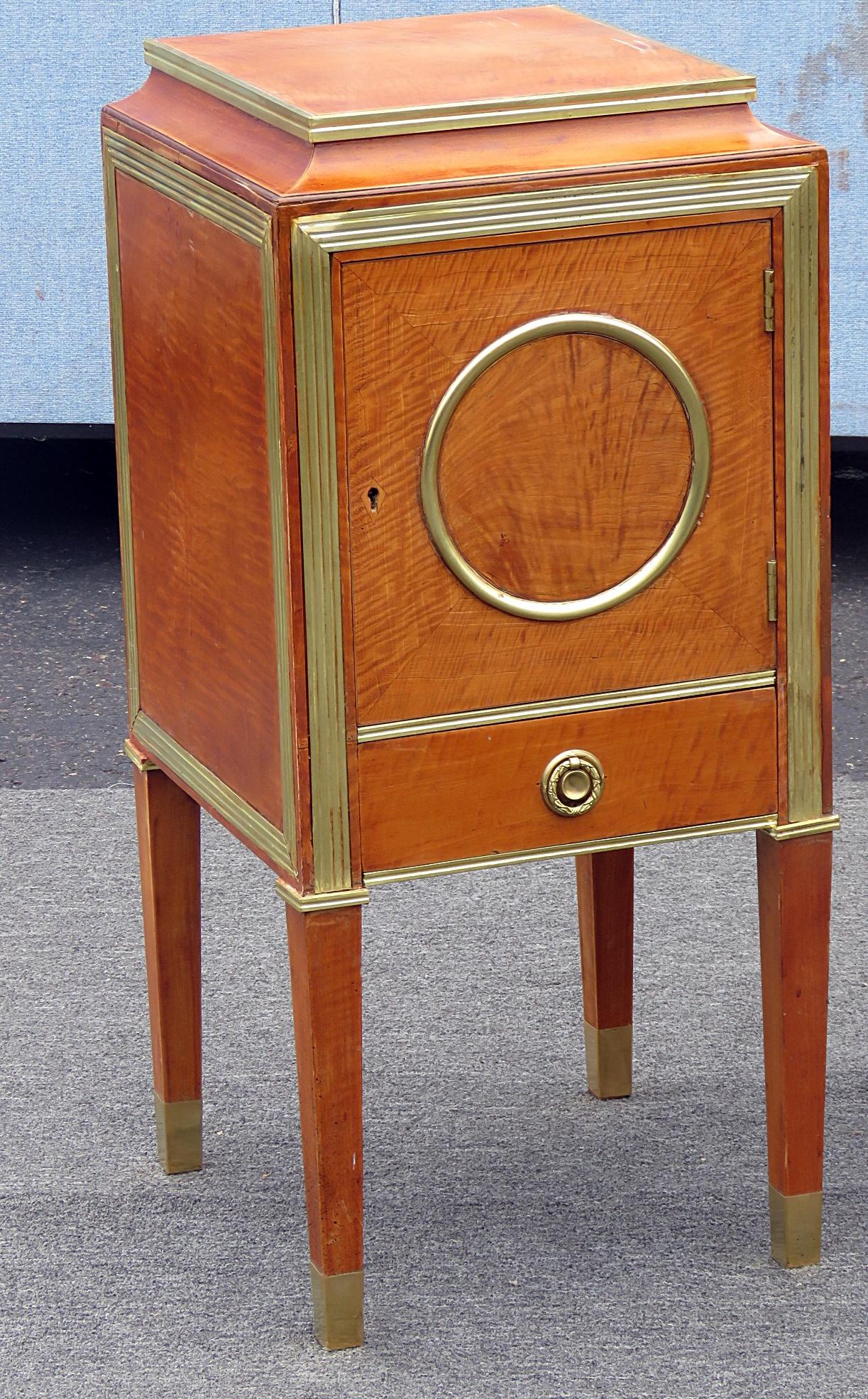 Pair of Russian Baltic style brass-mounted nightstands with one door over one drawer.