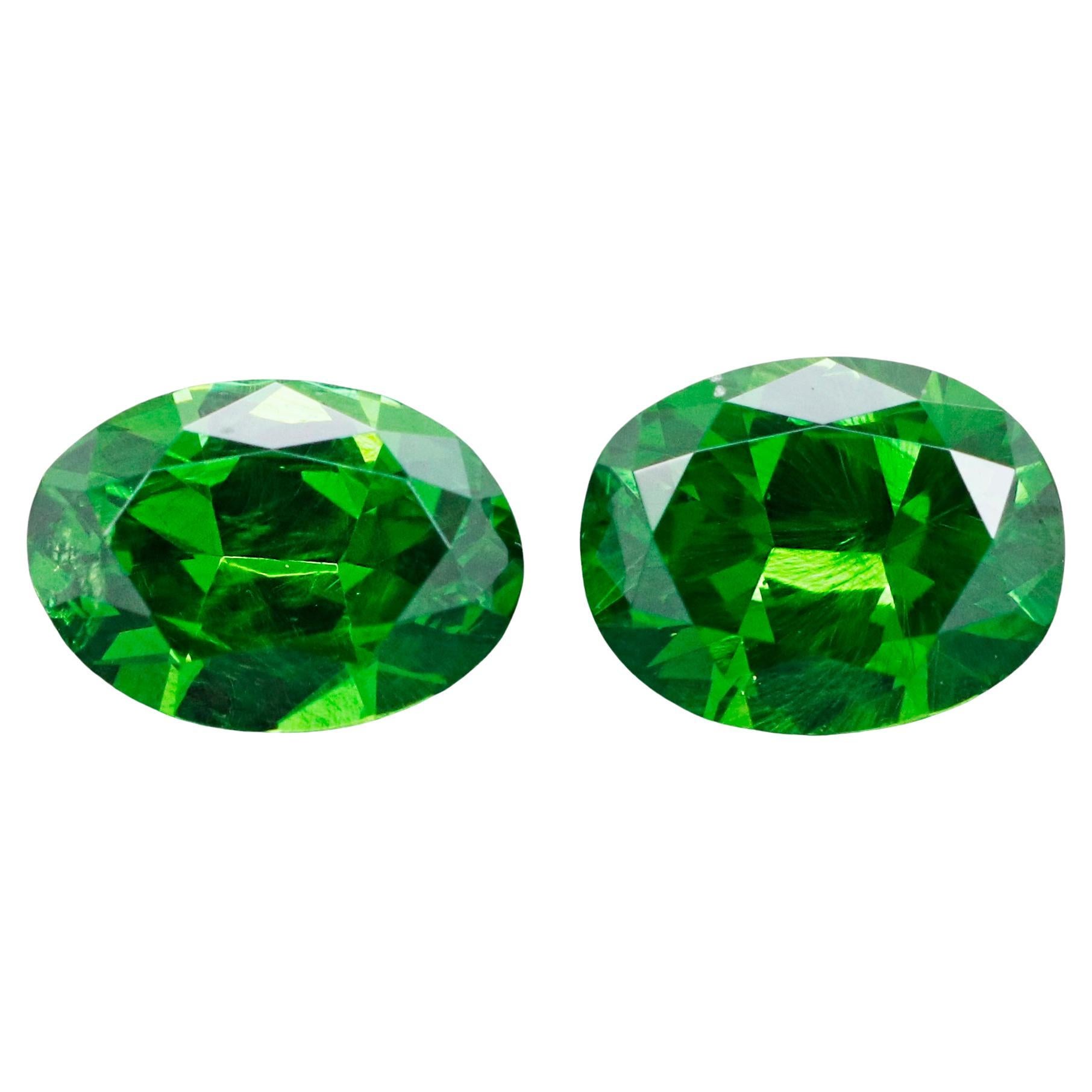 Pair of Russian Demantoid Garnets with horsetail inclusion 0.59 ct weight For Sale