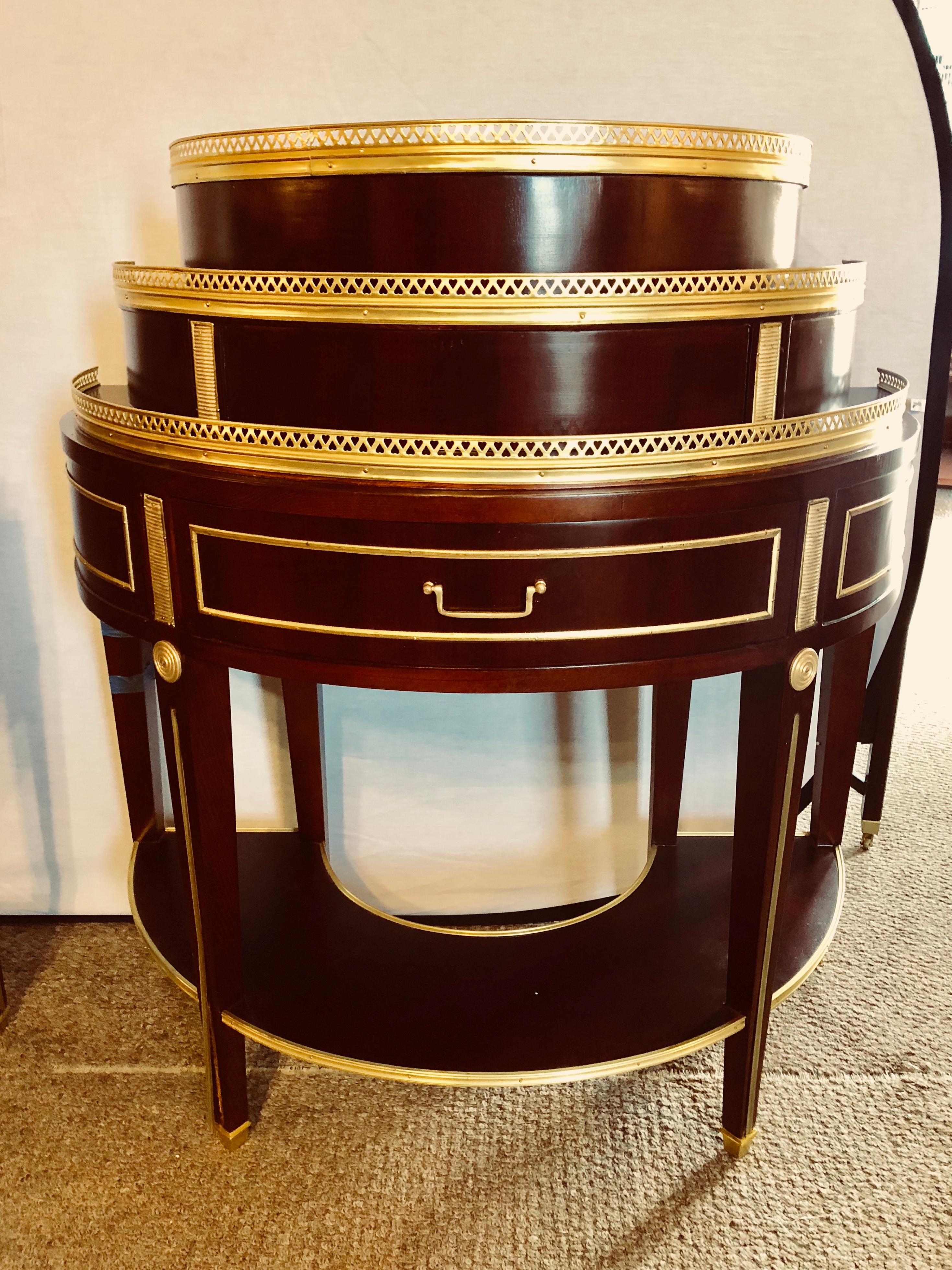A fine pair of Russian neoclassical pedestal style demilune end tables or nightstand / commodes. Each of these custom quality demilunes are simply stunning and are certain to spark conversation. The tapering bronze fluted legs having a bronze framed