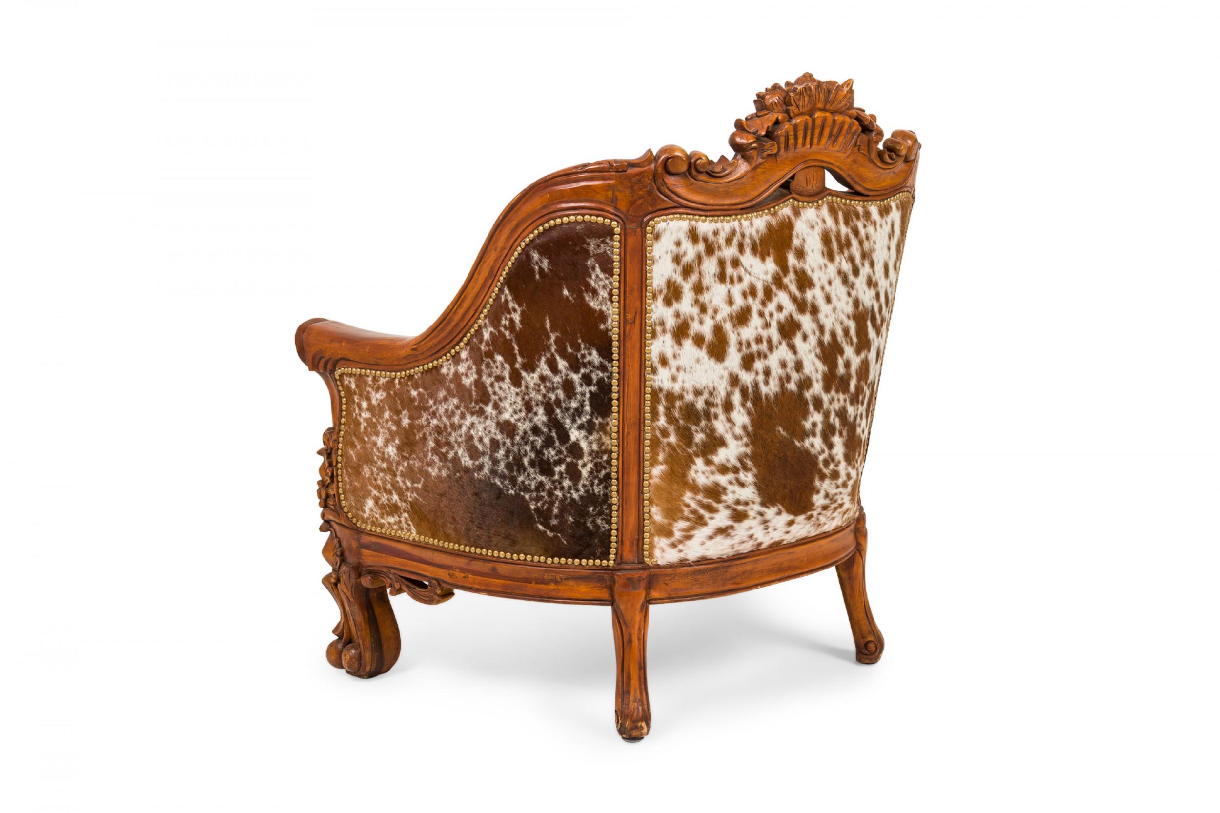 Pair of Rustic American Carved Walnut and Cowhide Wide Lounge / Armchairs For Sale 1