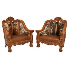 Pair of Rustic American Carved Walnut and Cowhide Wide Lounge / Armchairs