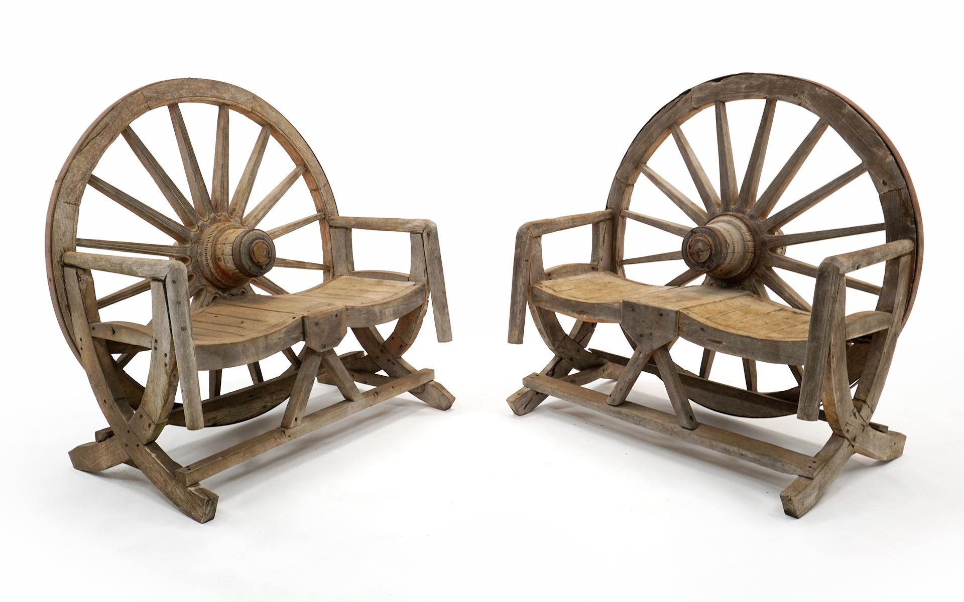 Two rustic wagon wheel love seat / settees in very good original condition. Made from actual antique wagon wheels. Both are very sound structurally and ready to use. The wood has an attractive worn appearance.