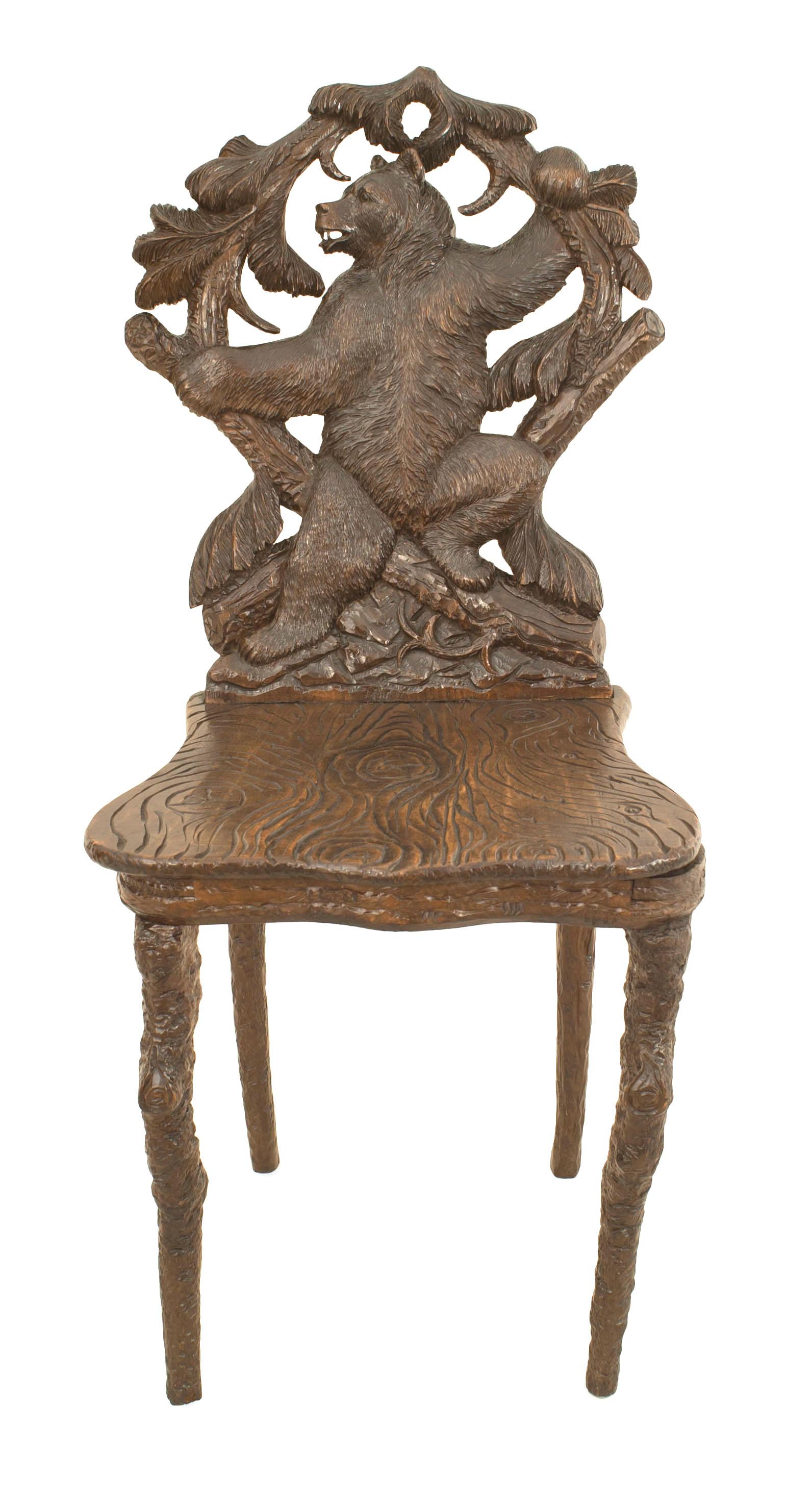 Pair of Rustic Black Forest (19th Cent) walnut side chairs with floral carving and bear figure on back with faux wood carved seat and legs (1 having music box seat)
