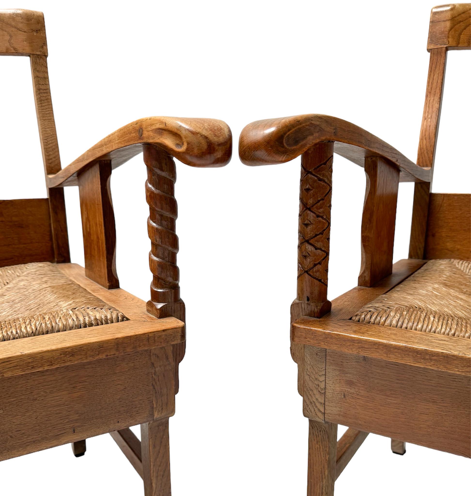 Magnificent and rare pair of Rustic armchairs.
Design by Anton Fortuin.
Striking Dutch design from the 1940s.
Solid oak frames with original rush seats.
Please note that we have six armchairs in total and all six have different and original