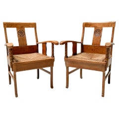 Pareja de sillones rústicos de roble tallado de Anton Fortuin, años 40