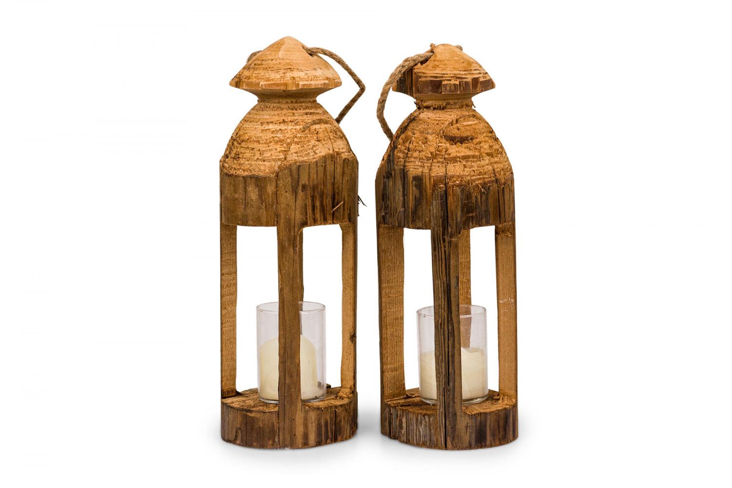 PAIR of Rustic carved wooden lanterns with open sides and anchored glass candle insets and rope handles. (PRICED AS PAIR).