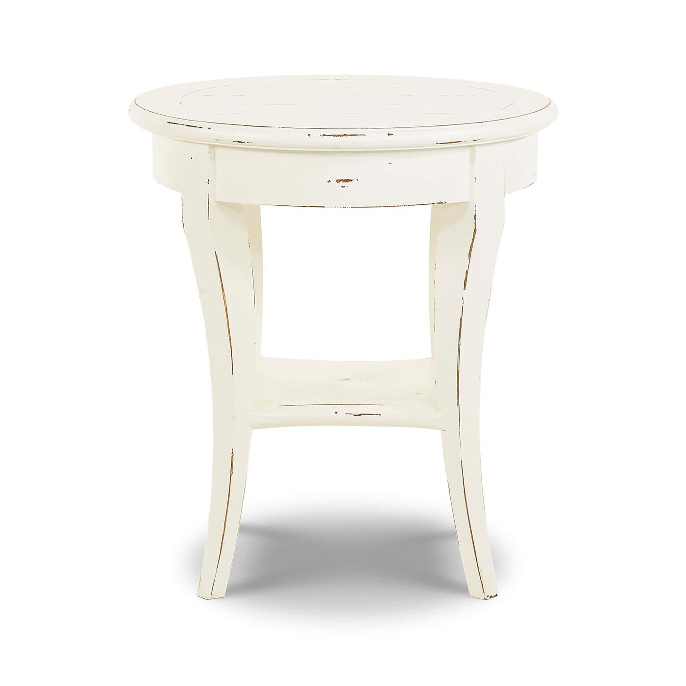 A perfect blend of rustic charm and timeless elegance. This round side table features a solid wooden frame with a beautifully distressed white harvest painted finish, adding a touch of vintage sophistication to any room. 

The elegant, curved legs