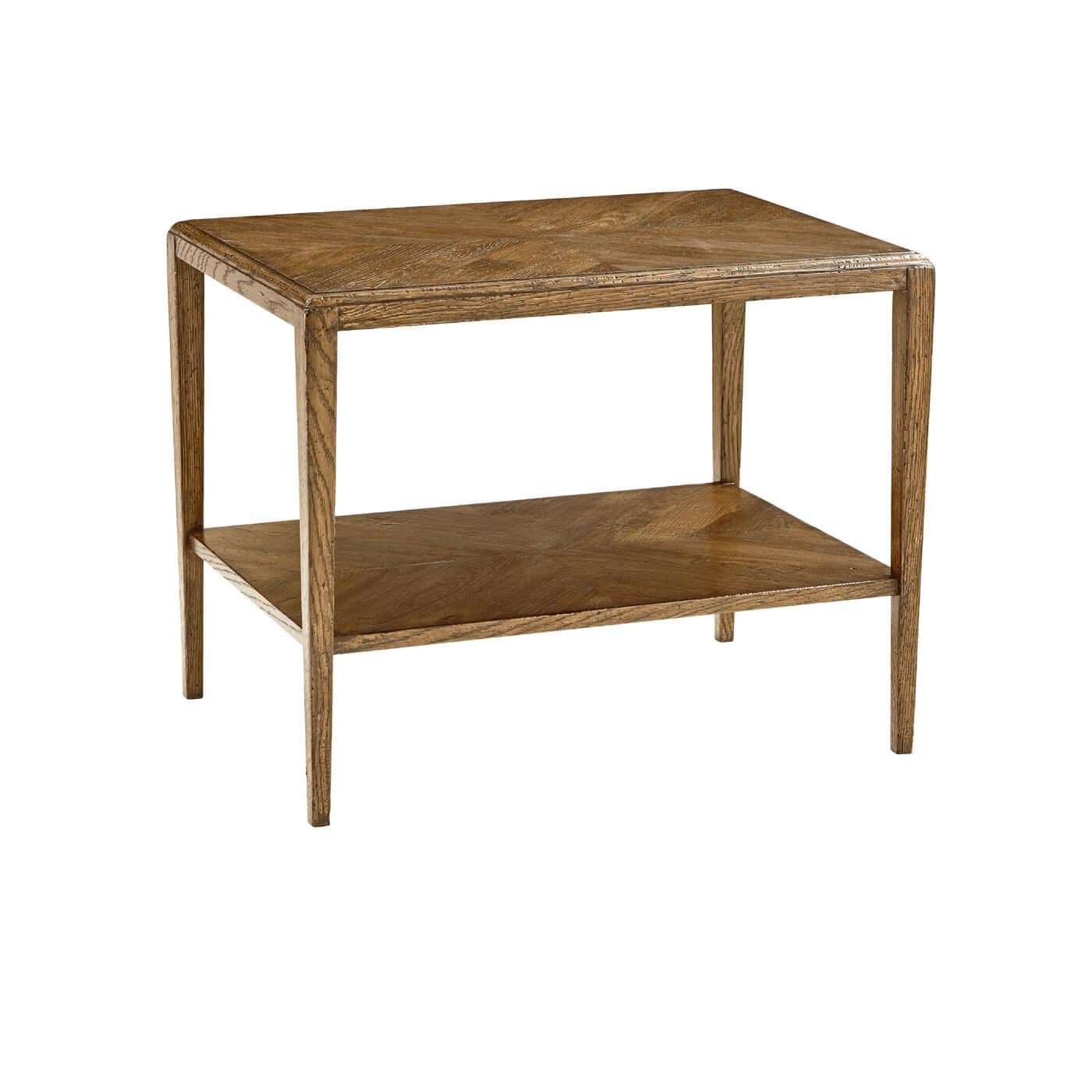 A rustic oak parquetry side table with rustic tapered oak legs. This beautiful rectangular shape table has a parquetry patterned top and bottom tier. 

Shown in dawn finish.
Dimensions: 28