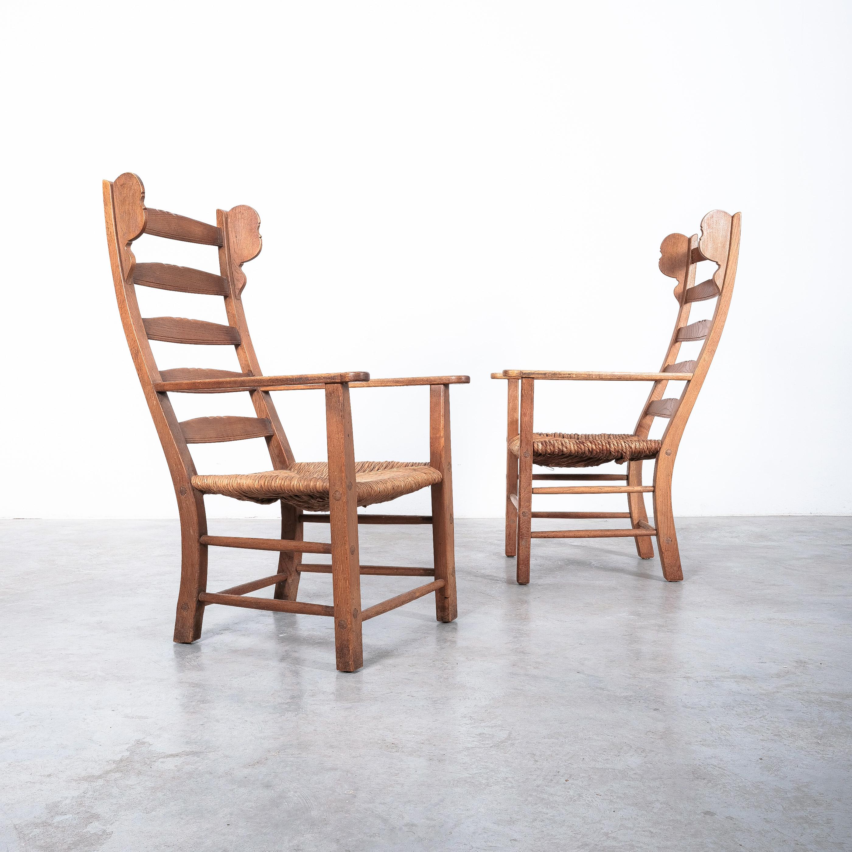 Pair of armchairs, beech, rope hemp, France, 1950s.

Gorgeous set of 2 almost identical arm-chairs, mid-century. One of the chairs is a bit taller and also the seat height differs about half inch. The seats are made of woven hemp rope which also