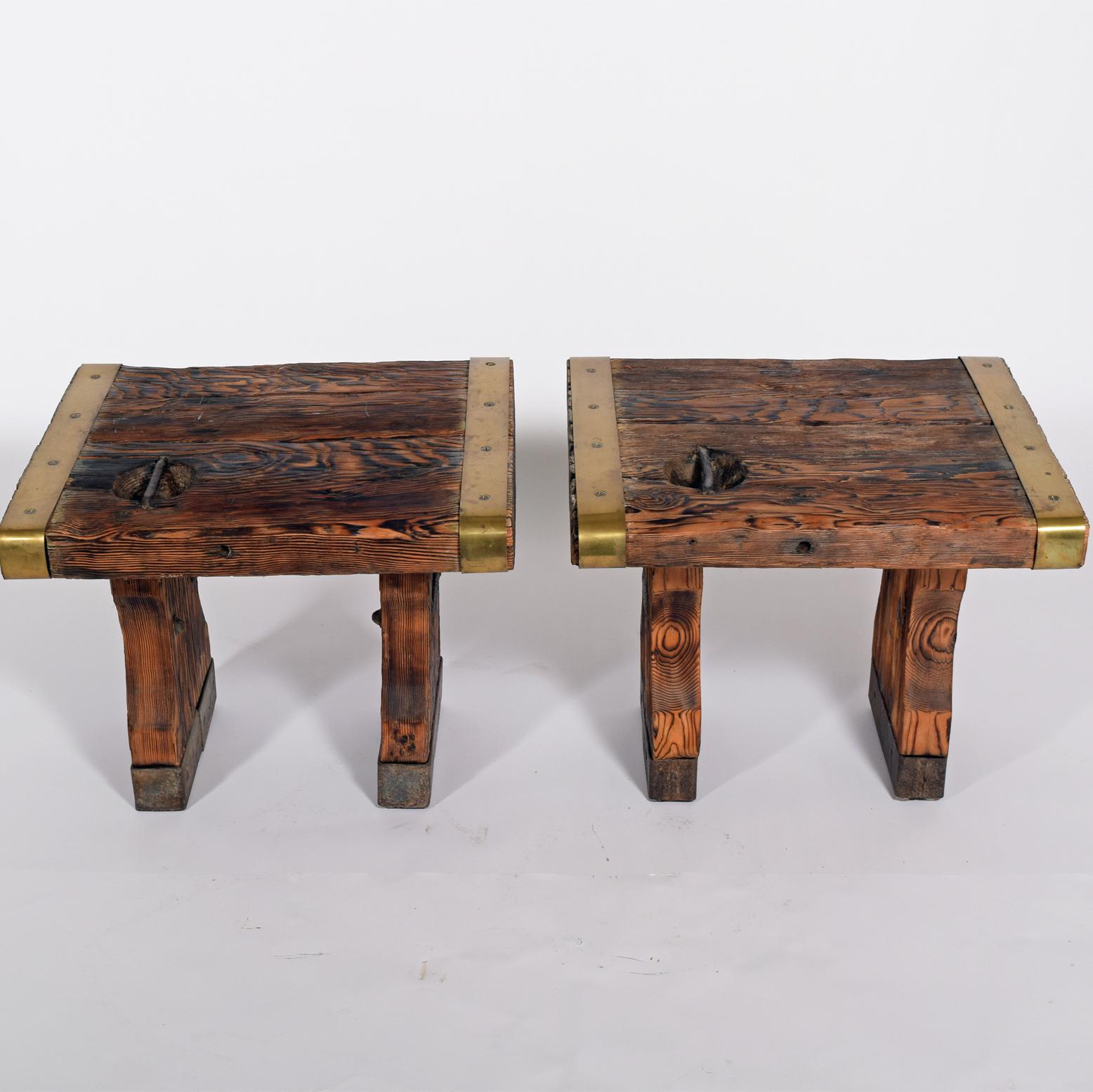 Two side tables / lamp tables made of heavy duty wooden planks assembled with strips of iron respectively. brass The planks originate from Leda Maersk cut up in Taiwan 1977.