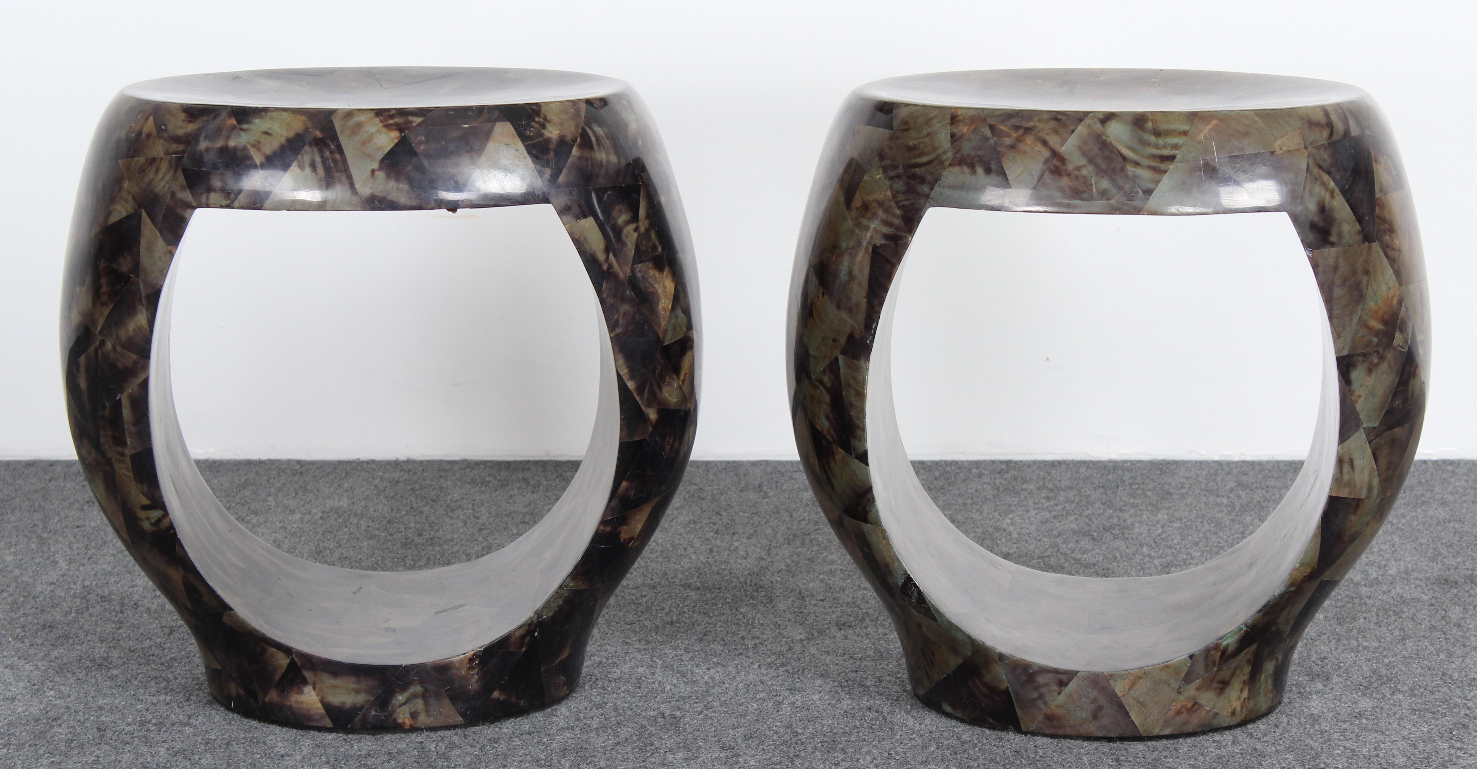 A curvaceous pair of labeled R&Y Augousti Pen-shell stools or benches. 

Dimensions: 19
